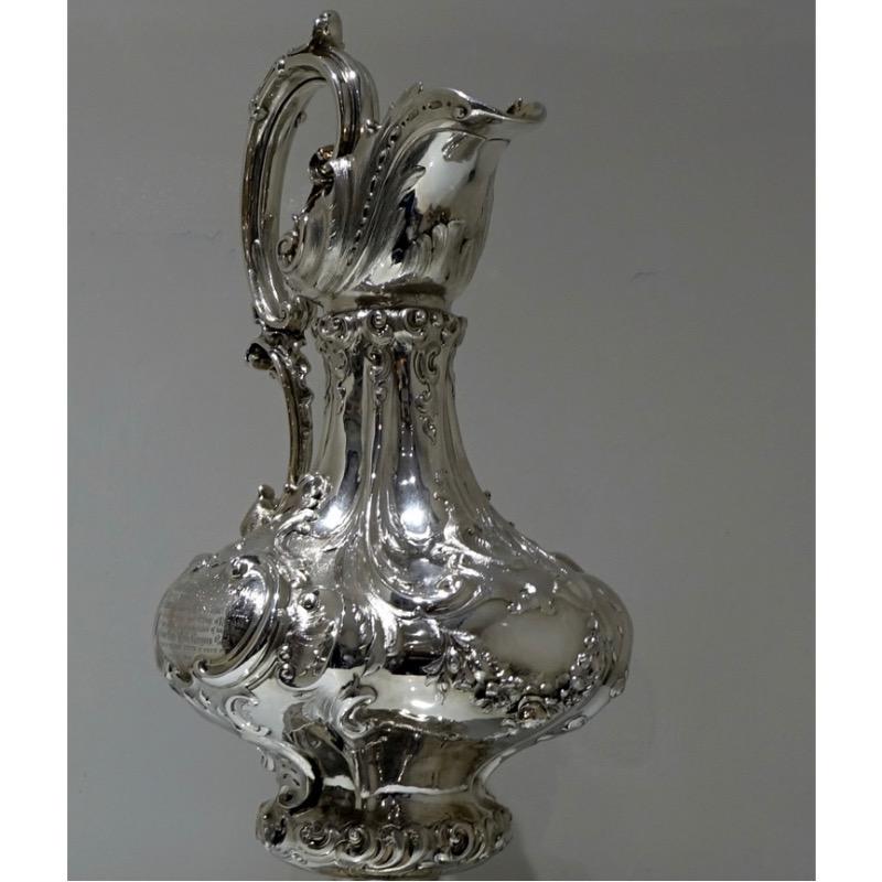 A splendidly large and incredibly important large Victorian wine ewer. 

A truly magnificent and  large wine ewer displaying inspired use of the scroll designs.  The splendidly decorative bulbous body has a double cartouche in which sits a
