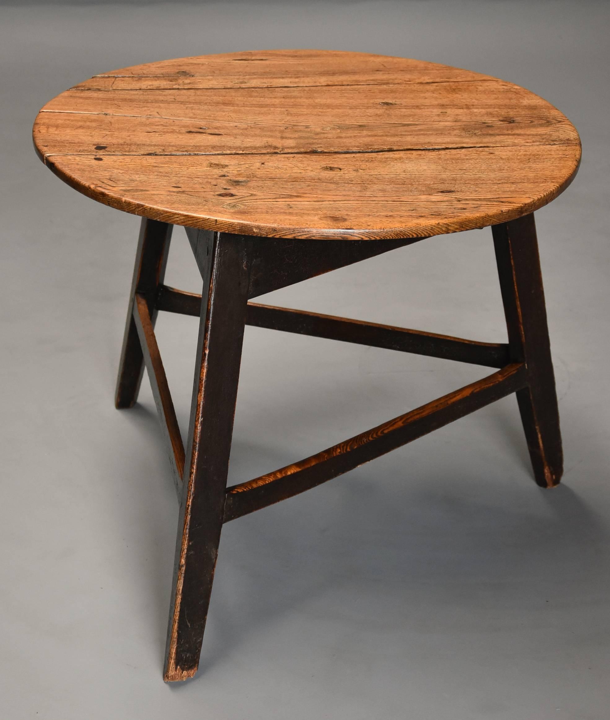 A nice example of a mid-19th century (circa 1840) ash cricket table with original painted base and great patina.

This table consists of a solid, well figured three plank ash top with good patina (color), below the top the painted ash base