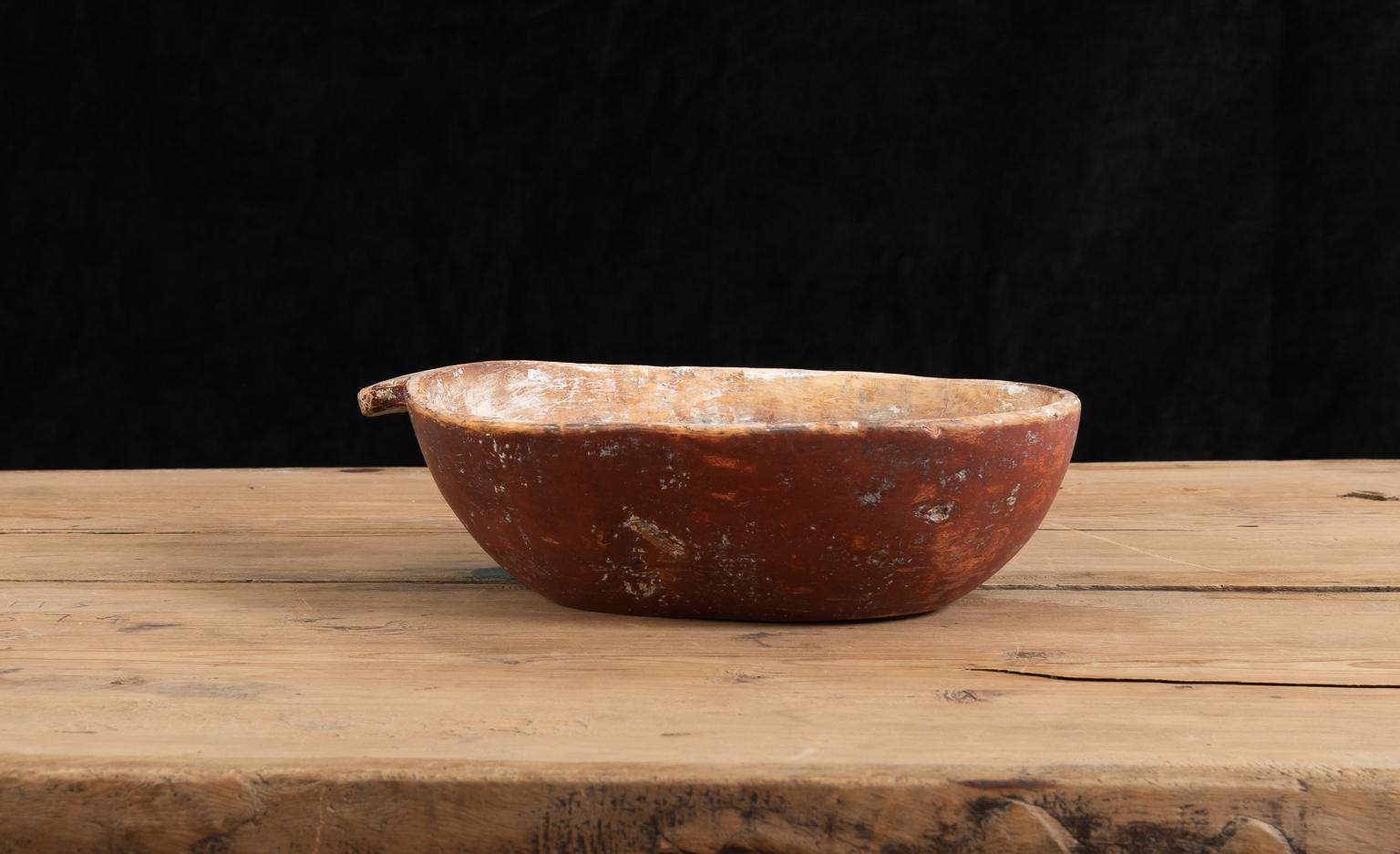 Mid 1800s Swedish wooden bowl manufactured from birch burl. The bowl has a handle manufactured from the same single piece of wood as the rest of the bowl. It is dated with 1850 and has a monogram under the bottom. The paint is original. From