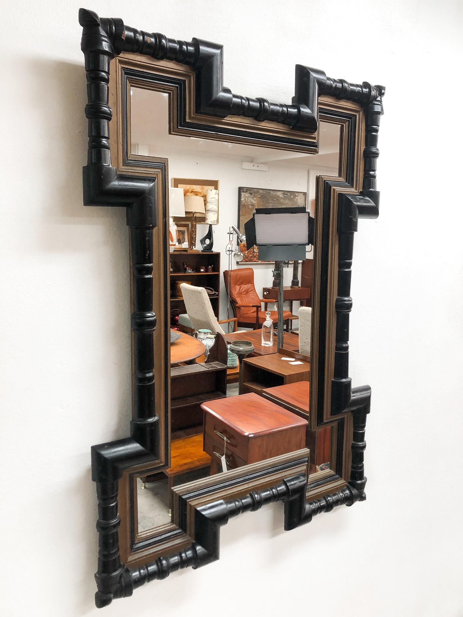 Stunning mid 1800s Dutch wall mirror. ebonized and gilded.