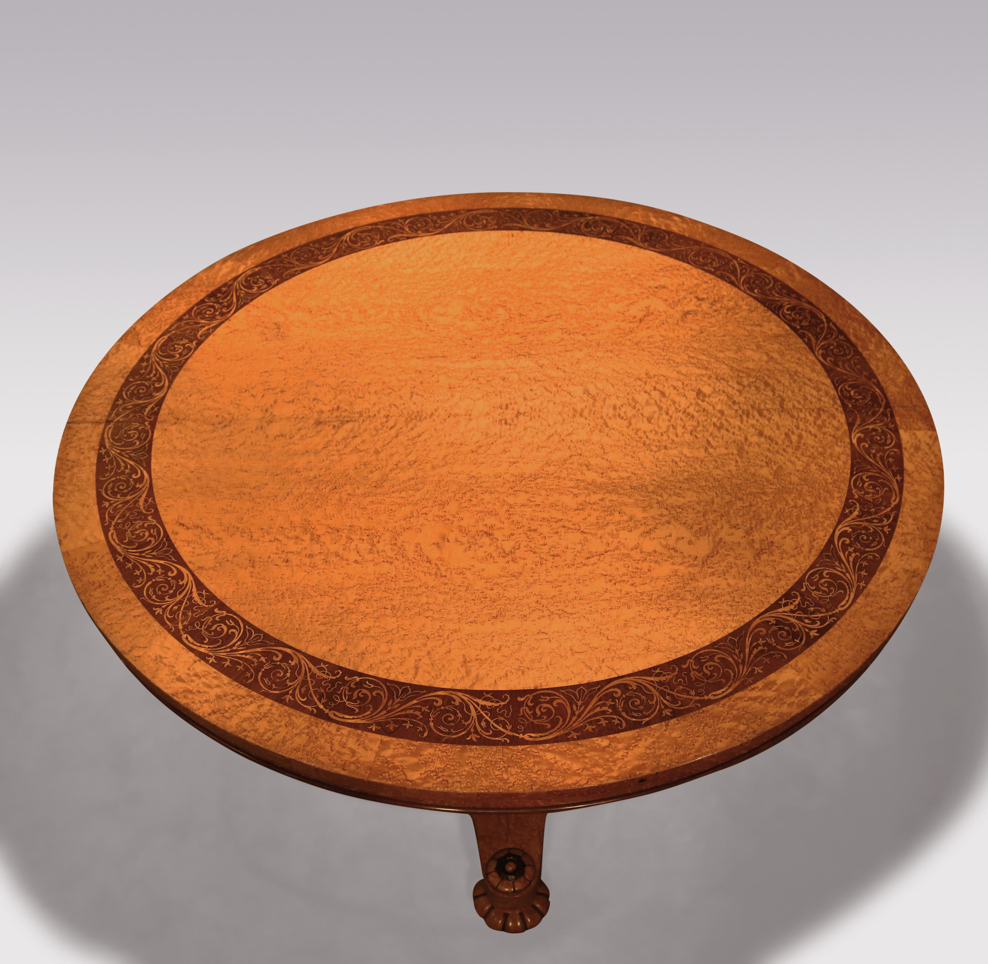 A fine mid-19th century bird's-eye maple centre table by Taprell and Holland & Sons, having circular rosewood scrolled crossbanded top, above shaped baluster stem and triform platform, with carved collars, ending on bun feet with carved rosettes.