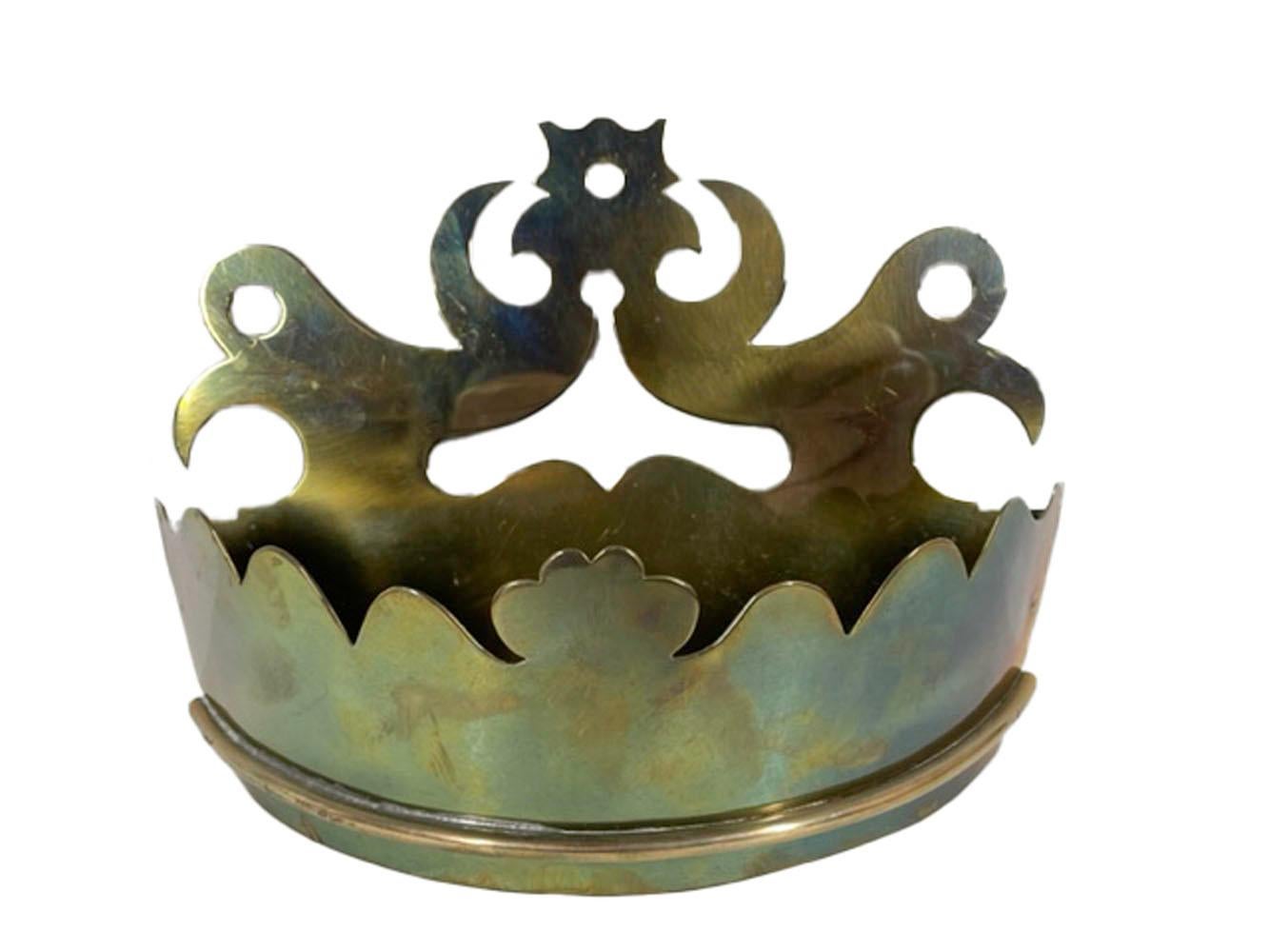Nineteenth century polished brass wall pocket or tidy of crown form with a bowed front having a shaped top edge and pierced design above an applied red brass beaded molding. These were used by the fireplace or entry door to keep matches, keys, mail,