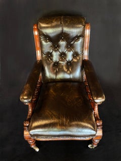 Mid 19th Century Brown Leather Library Chair with Carved Dolphin Arms, Mahogany