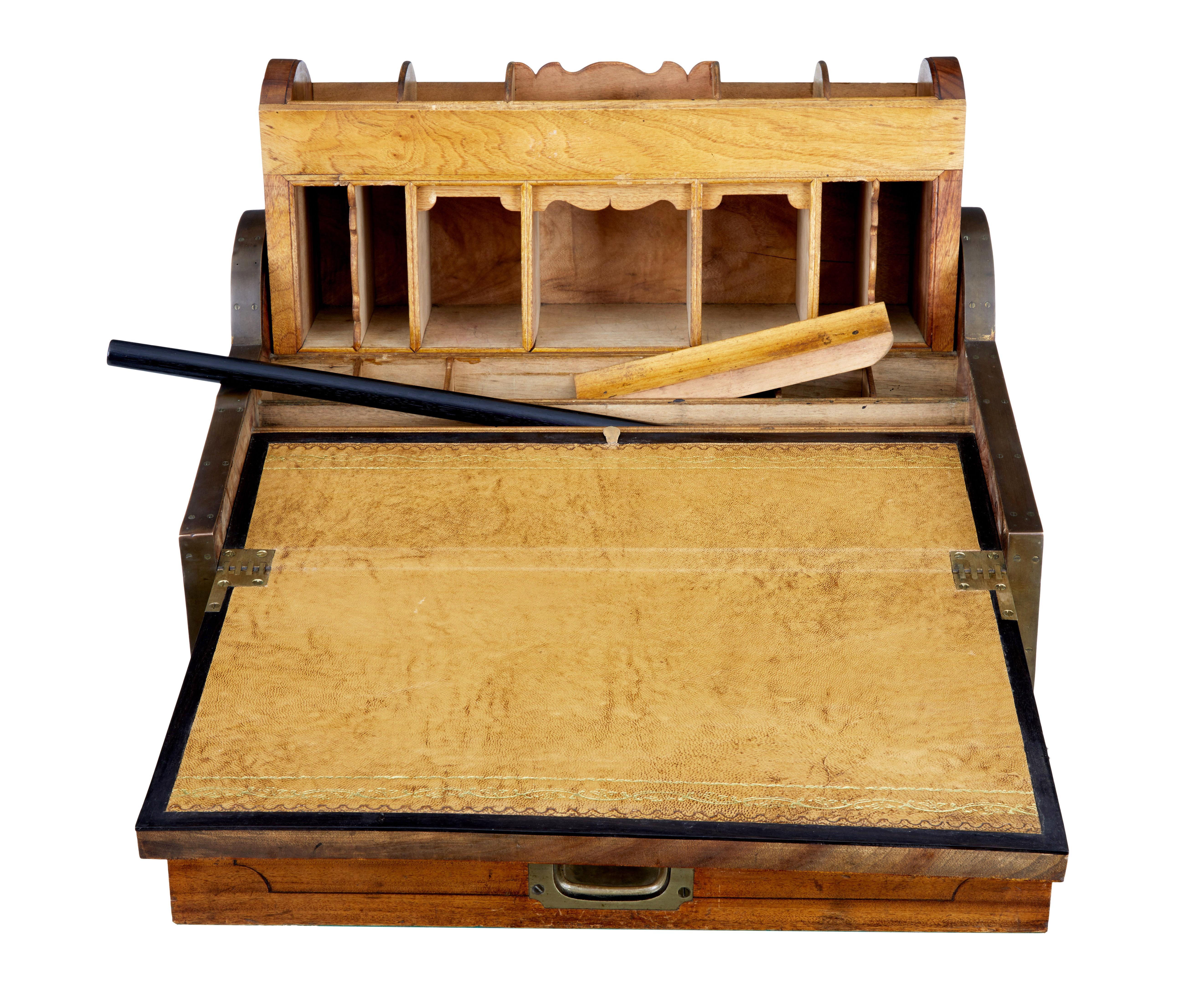 Rare and good quality Campaign camphor wood writing desk, circa 1860.

Brass bound around the outer edges and carrying handles to each side. These desk were made for sea captains and officers in the field, know as campaign furniture. Unused brass