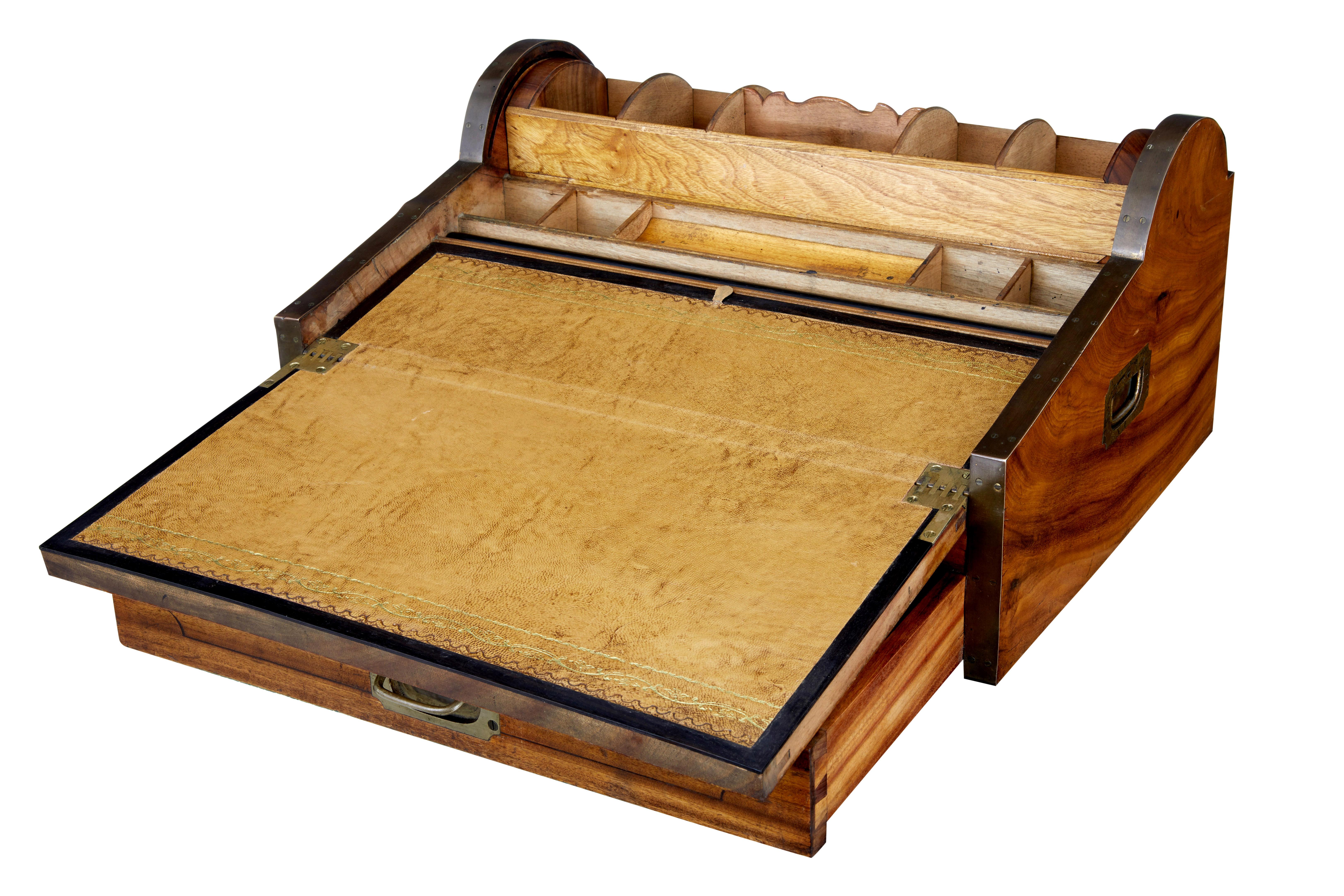 Rare and good quality Chinese export camphor wood writing desk, circa 1860.

Brass bound around the outer edges and carrying handles to each side. These desk were made for sea captains and officers in the field, know as campaign furniture. Unused