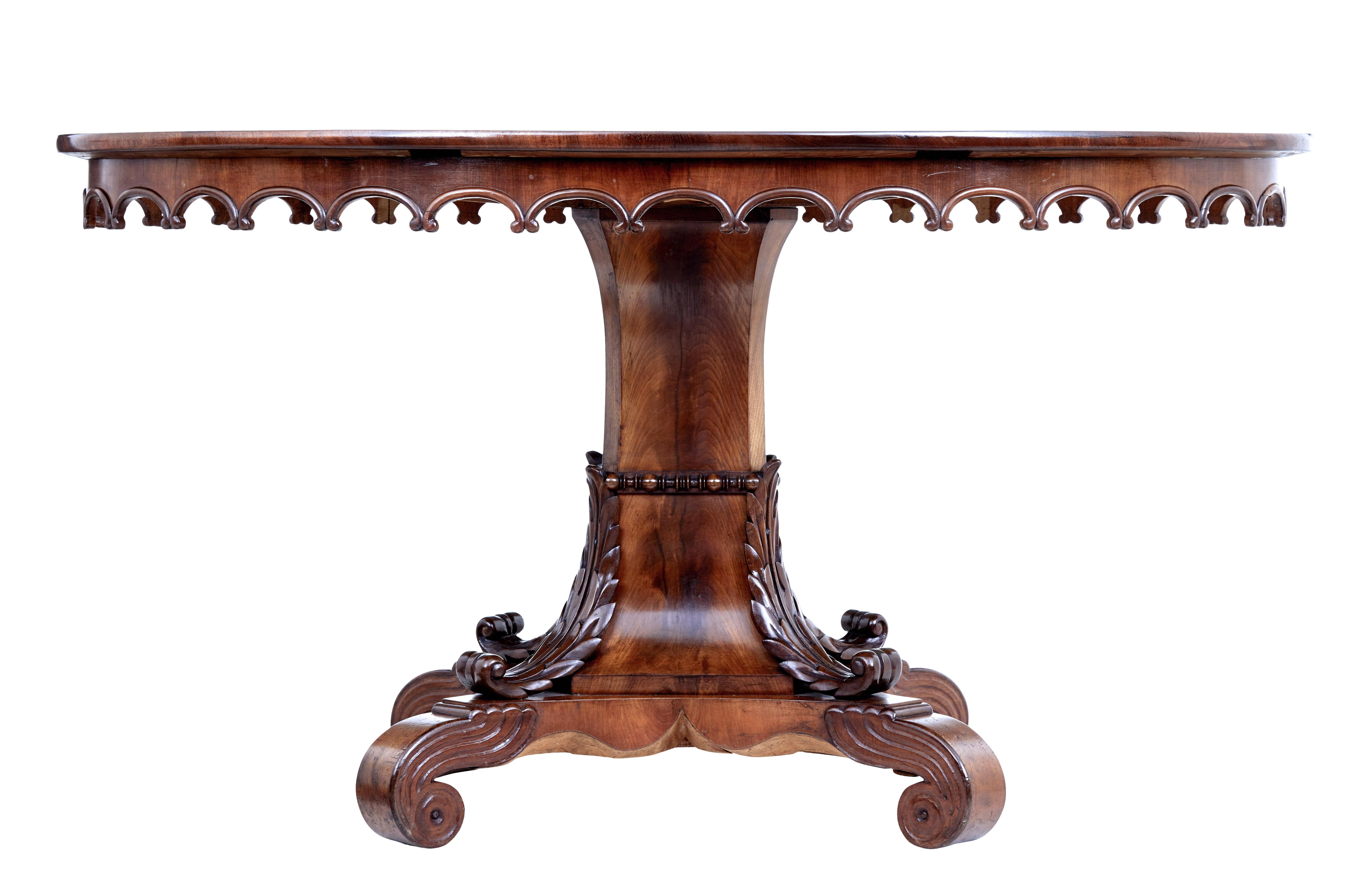 Mid 19th century carved flame mahogany oval center table, circa 1860.

Beautiful Swedish mahogany table. Oval top with matched quarter veneers in flame mahogany, decorative carved frieze below the top surface. Pedestal base with stunning applied