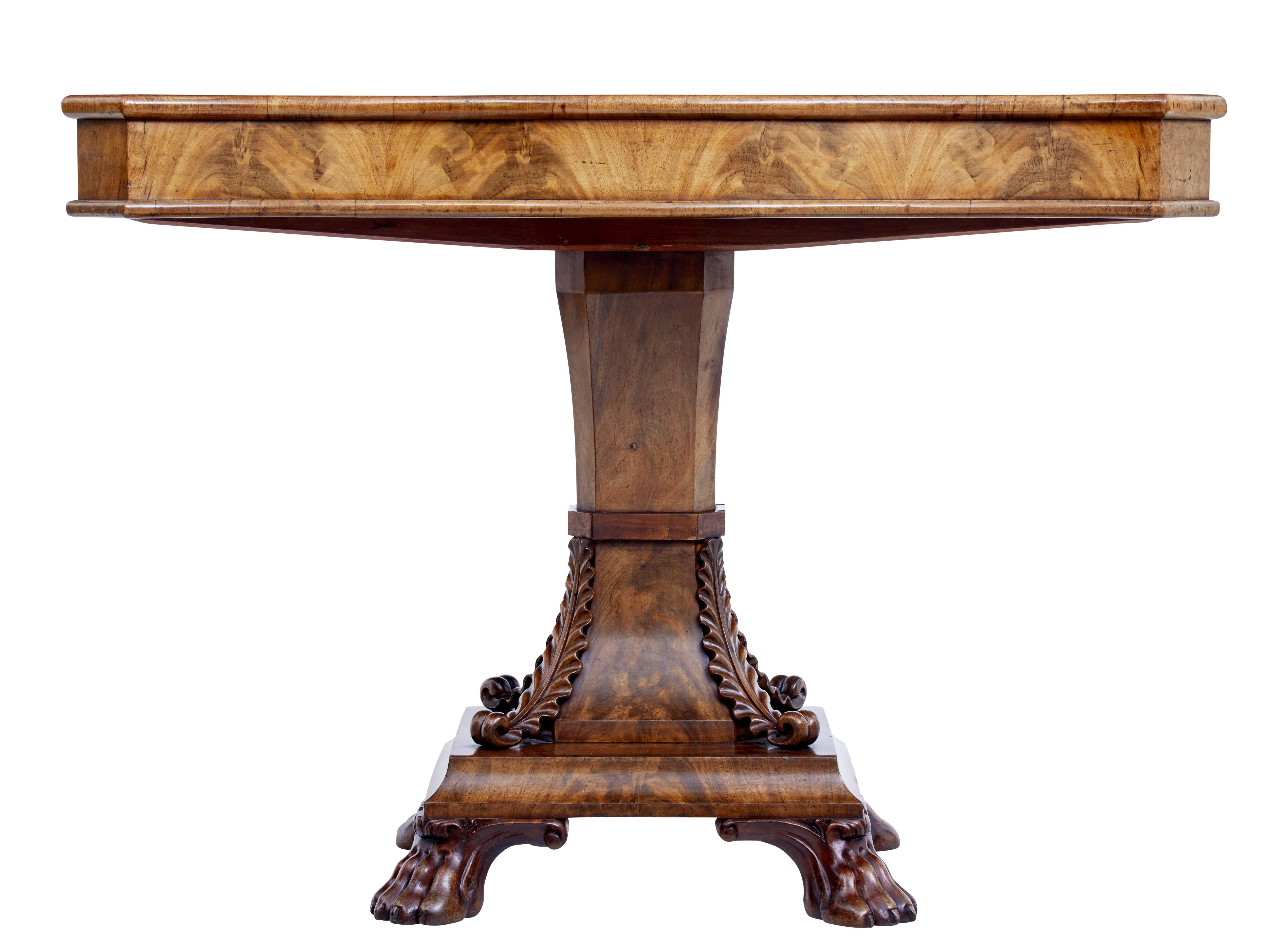 Mid-19th century carved Swedish flame mahogany centre table, circa 1840.

Serpentine shaped top with matching quarter veneers. No drawer, making this a center table, but could be used as a sofa table.

Standing on a fluted stem, with applied