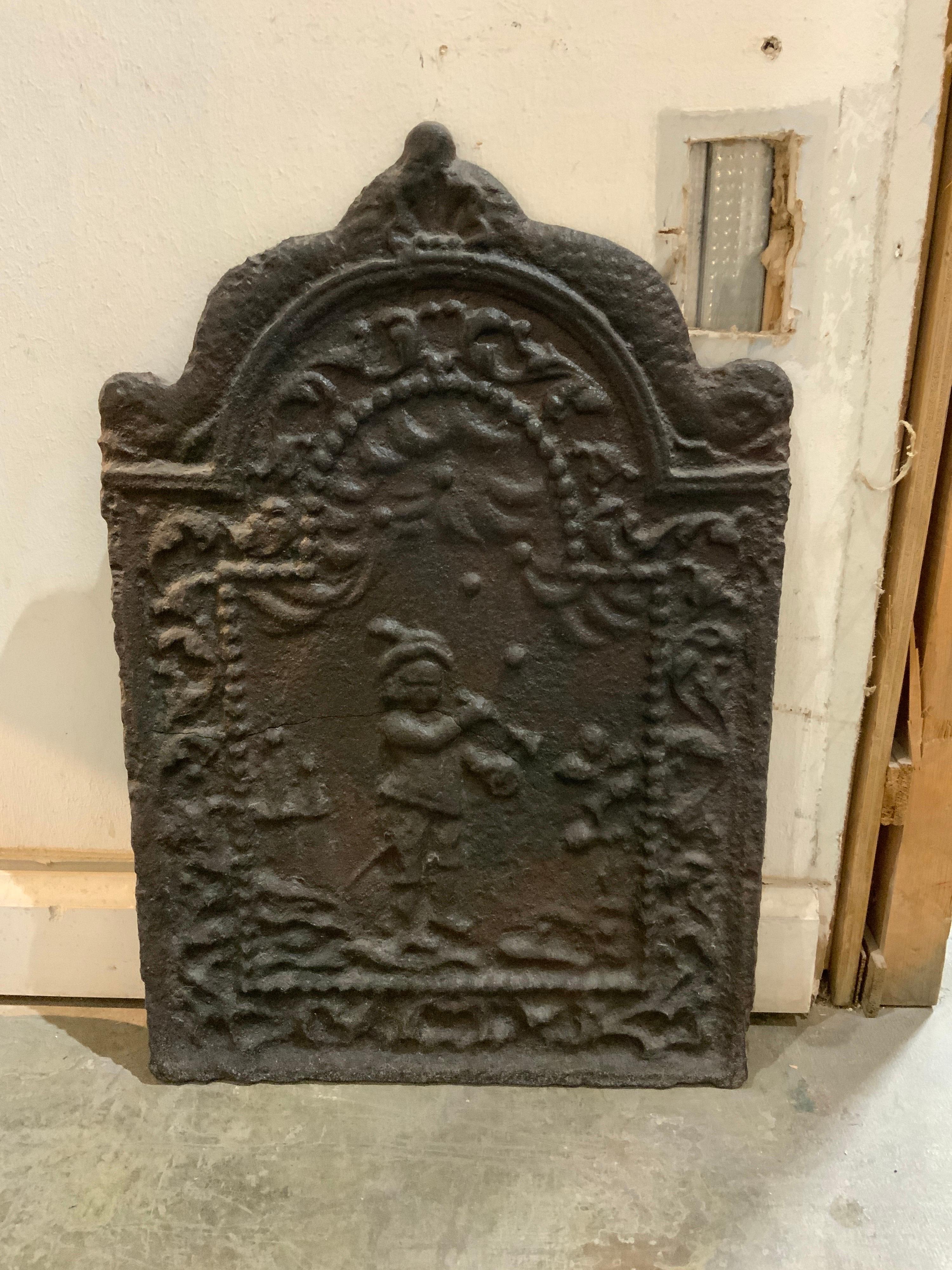 This cast iron fireback origins from France, circa 1850.

 