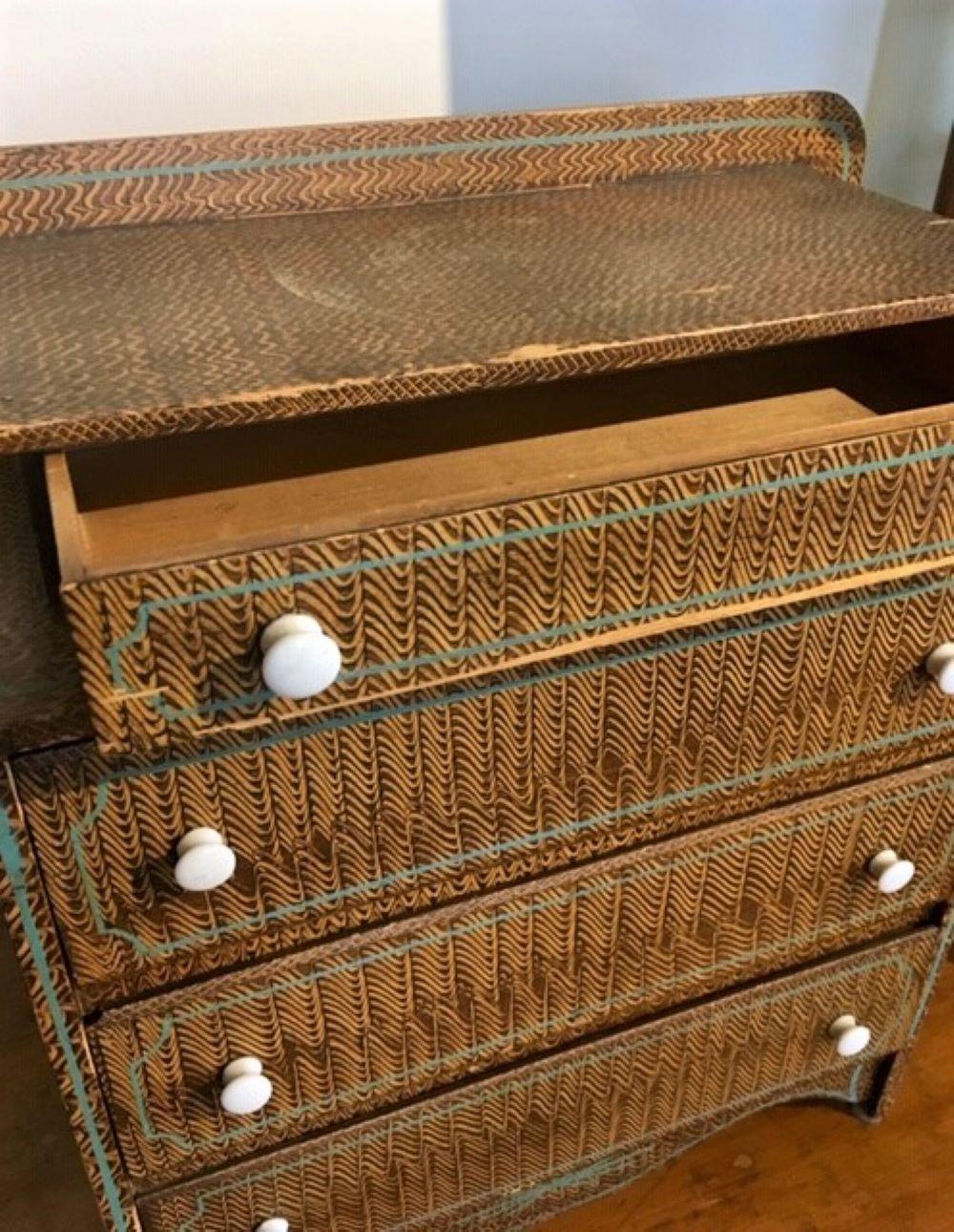 Mid-19th century Benchmade child’s grain painted Miniature chest of drawers. A country piece in the American Empire style, with a step-back drawer and backsplash, above the case with three drawers, all with white porcelain knob pulls, in a lovely