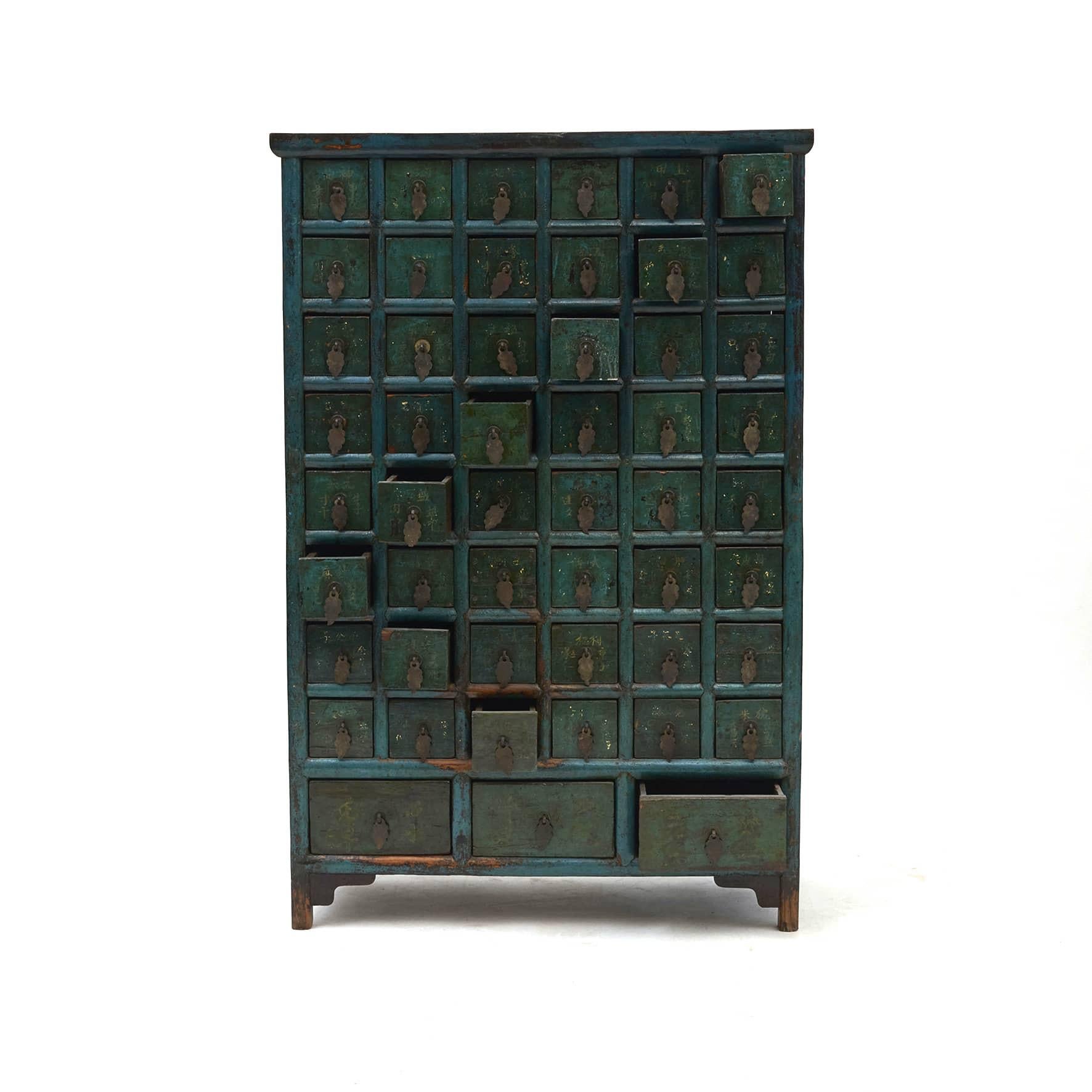 A Chinese lacquered apothecary, circa 1840-1860.
Elm wood with original lacquer. The front with green and petrol blue lacquer, sides and top with black lacquer.
With 51 drawers each with Chinese script for herbs, minerals and natural remedies.
In