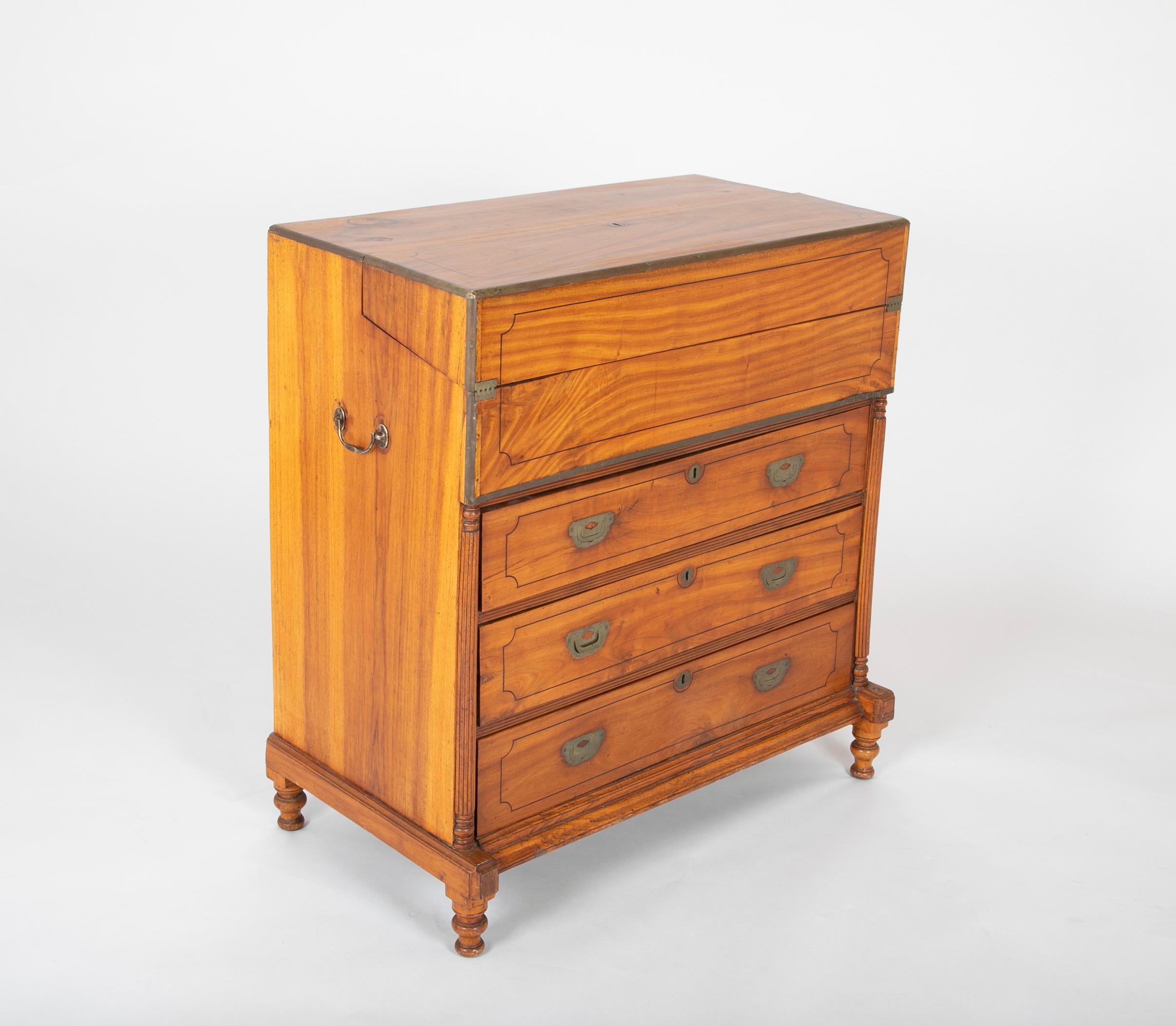 Mid-19th century Chinese export camphorwood campaign chest with 3 drawers with inlaid ebony and fold out desk with old green felt on writing surface and several interior cubbies. One of carrying handles and one interior cubby pull are replacements.