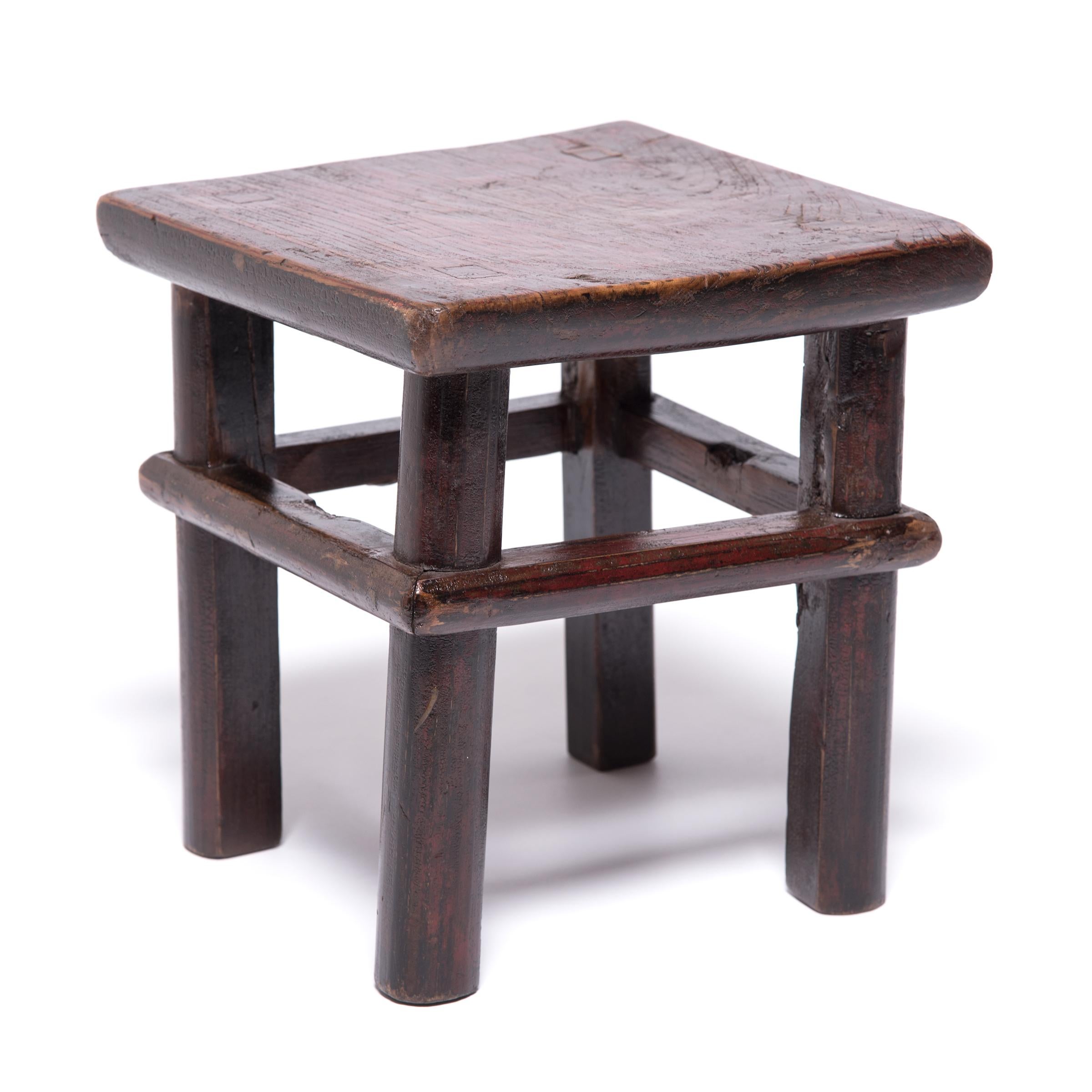 “Feng Deng,” which translates literally to square stool, remained a versatile form of casual seating in Chinese households well into the 20th century. Chinese carpenters of the Qing Dynasty held simplicity and craftsmanship in equal regard. In this