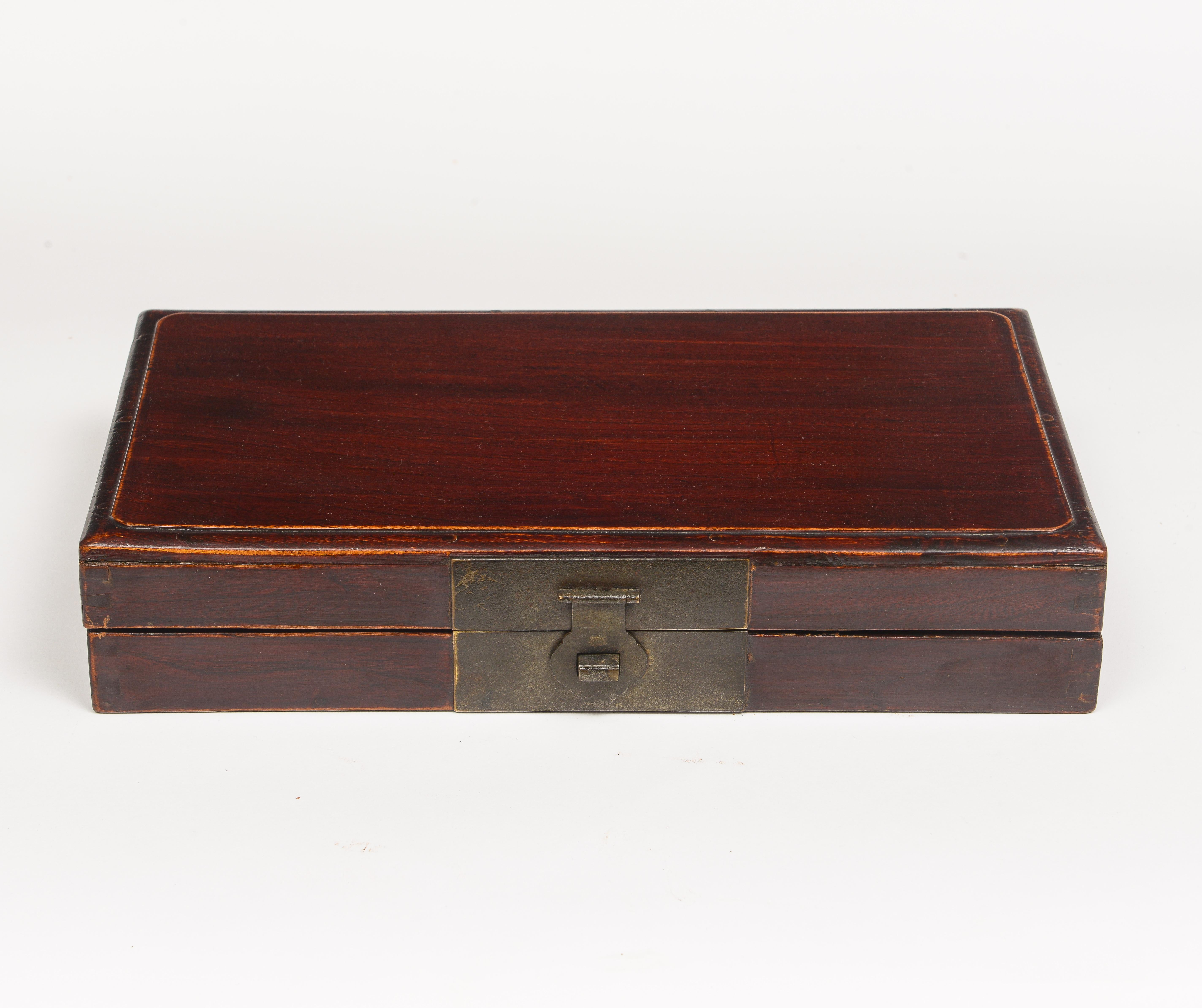 19th Century Red Stained Chinese Flat Box
Made of Jumu wood with brass hardware and decorative red and gold papered interior