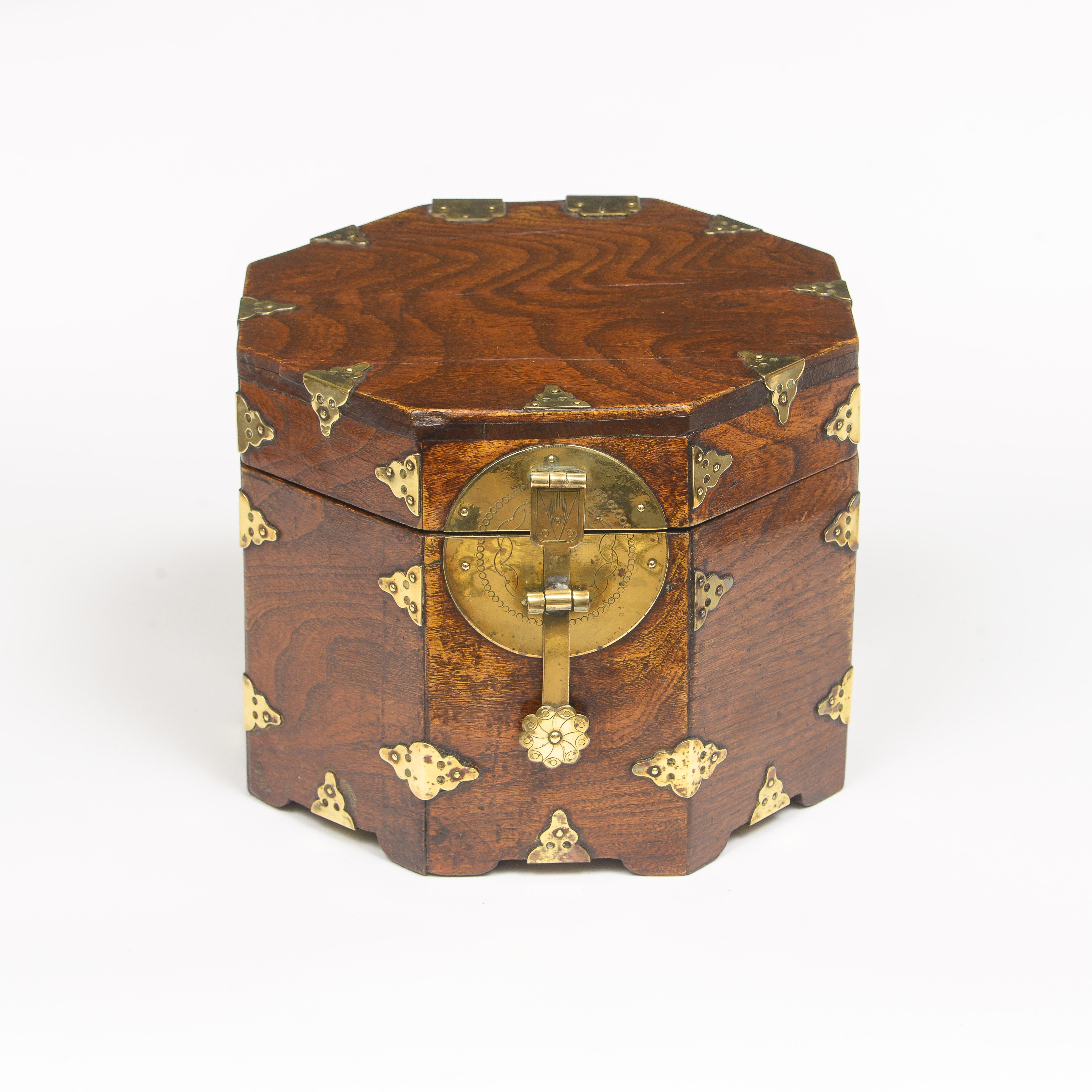 Brass bound octagonal Chinese Box
Made out of Jumu wood (Southern Elm)
Interior covered in Chinese paper