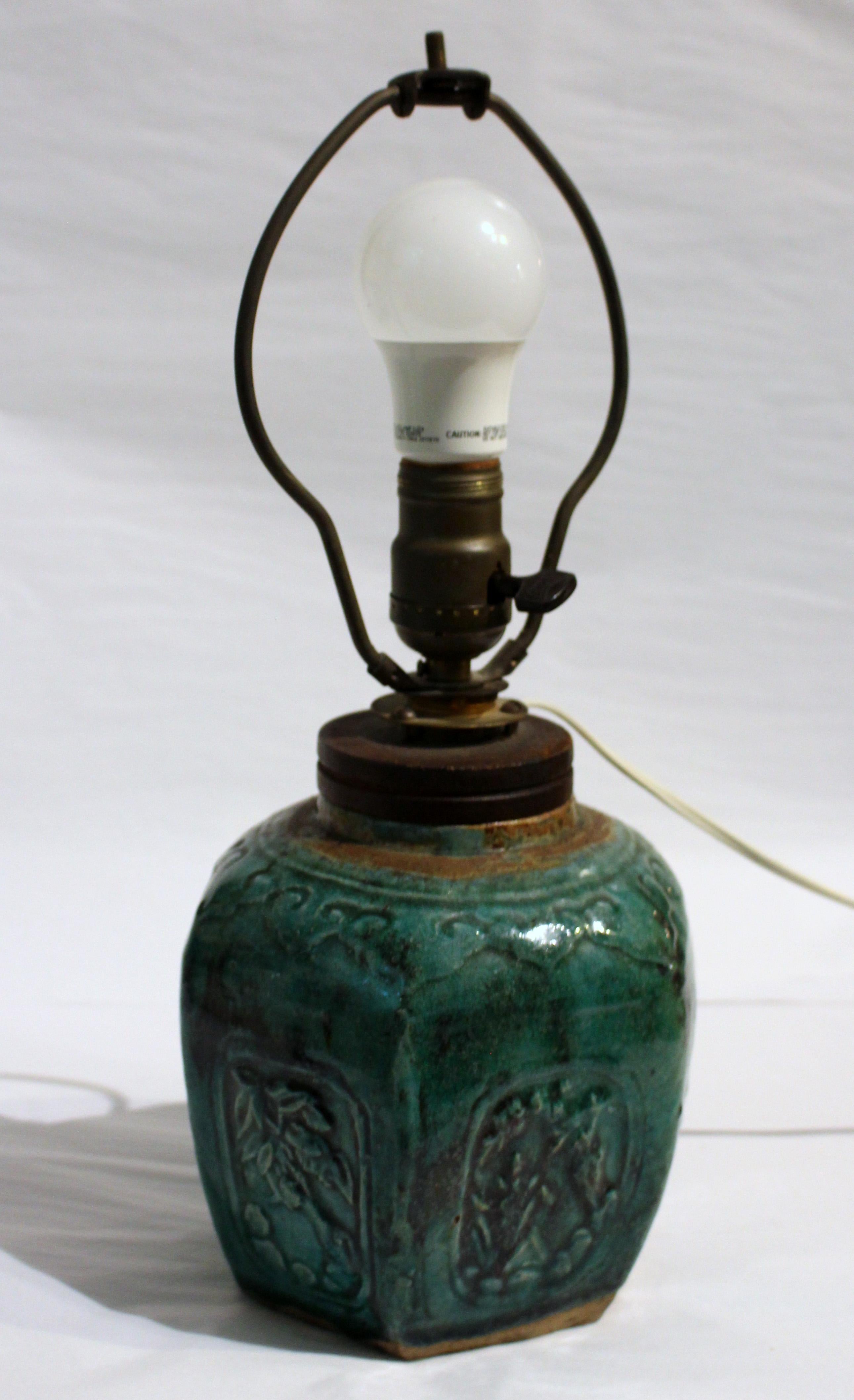 Mid-19th century ginger jar now mounted as a lamp. Chinese Qing dynasty hexagonal jar with molded panels of flowers, lappet shoulders. Four the Persian export market. Lamp sockets into mouth of jar. 16