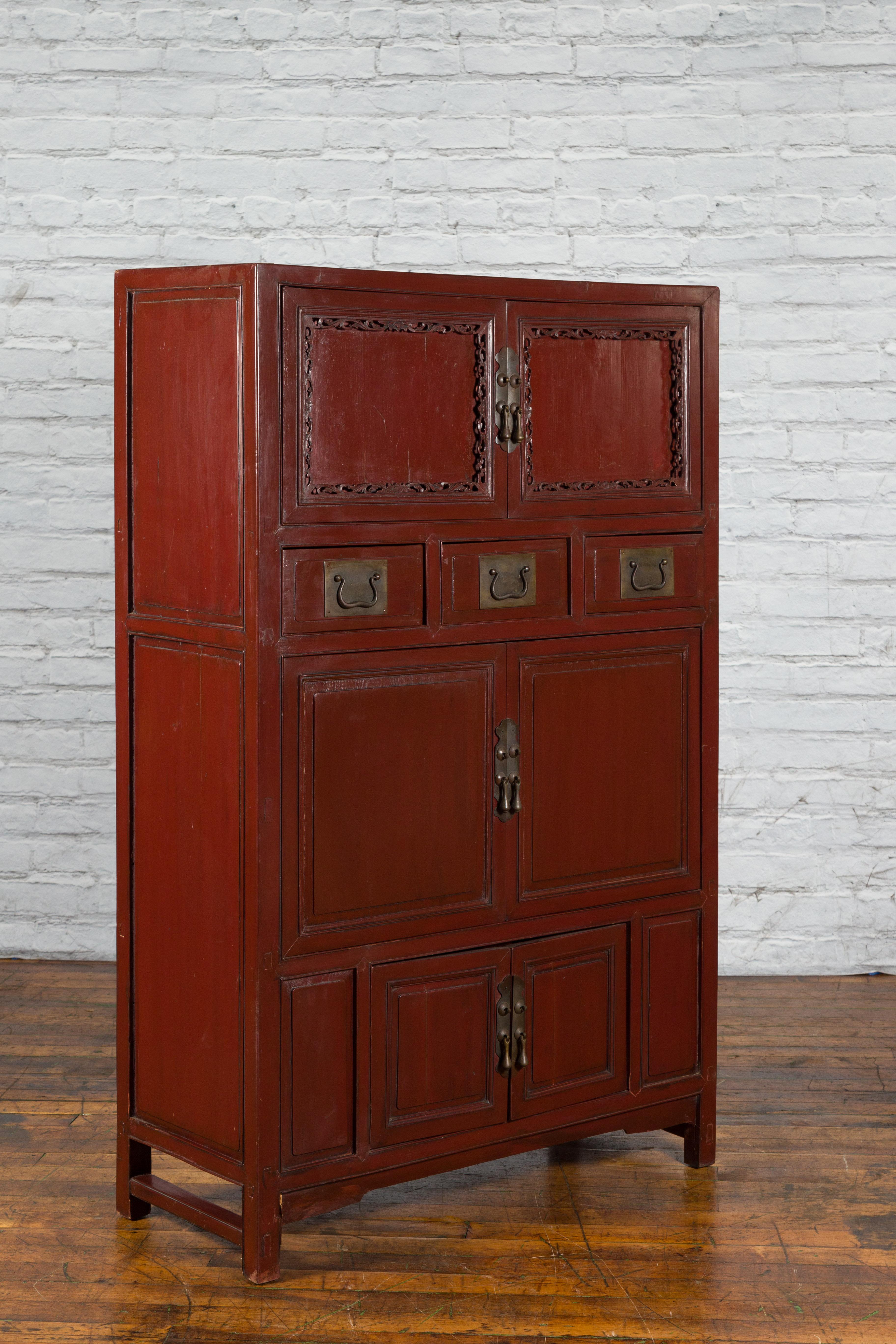 Lacquered Mid-19th Century Chinese Qing Red Lacquer Cabinet with Multiple Carved Doors For Sale