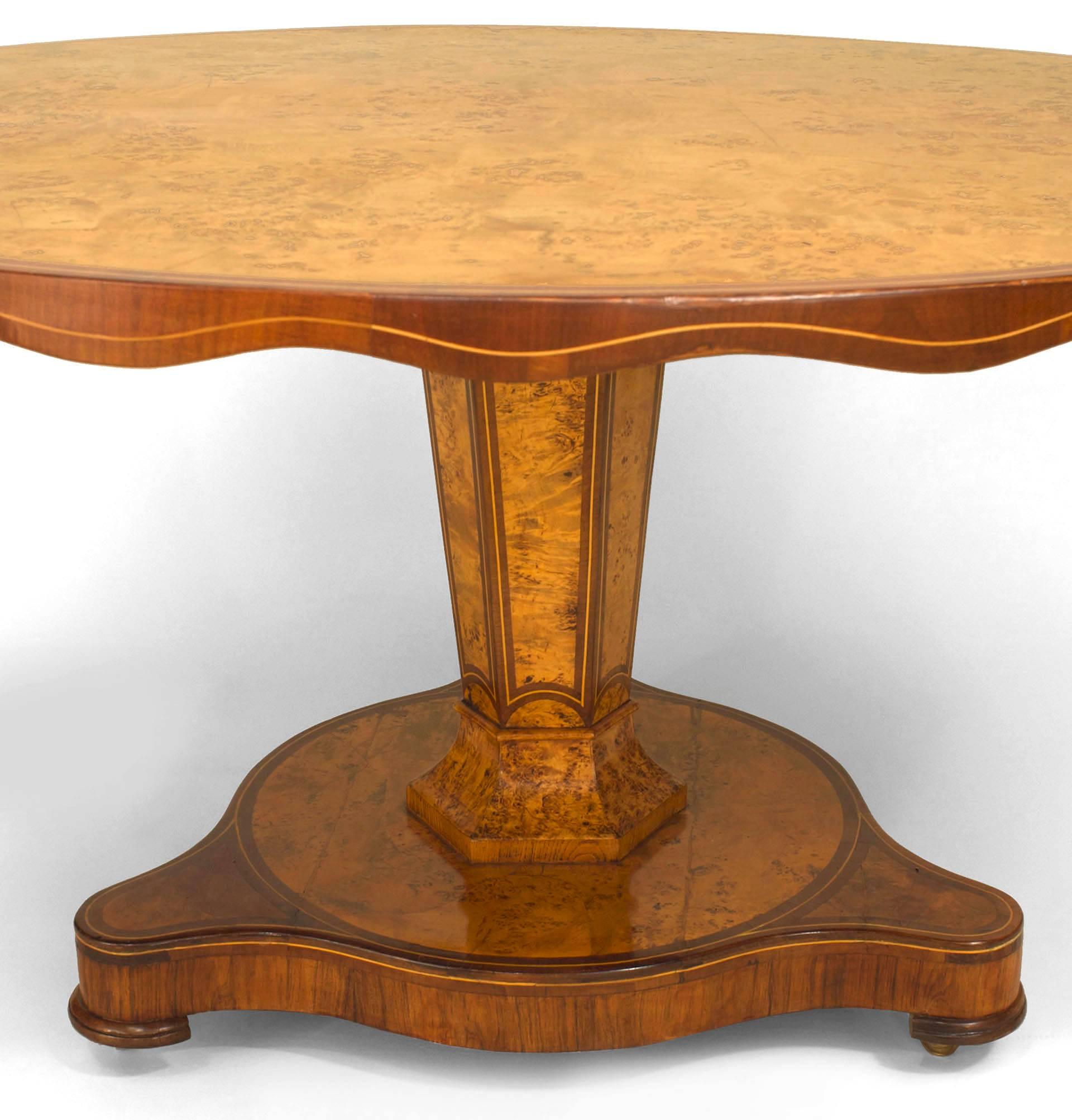Continental possibly Baltic (circa 1850s) burl wood and mahogany trim center table with an octagonal base supported on a triangular base with a top having a scalloped apron.
