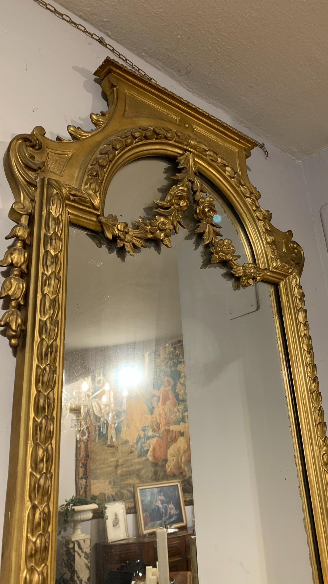 Elegant pair of mirrors in neoclassical style in carved and gilded wood with pure gold leaf. Typical Tuscan manufacture of the 19th century.

MEASURES: cm 145x56.