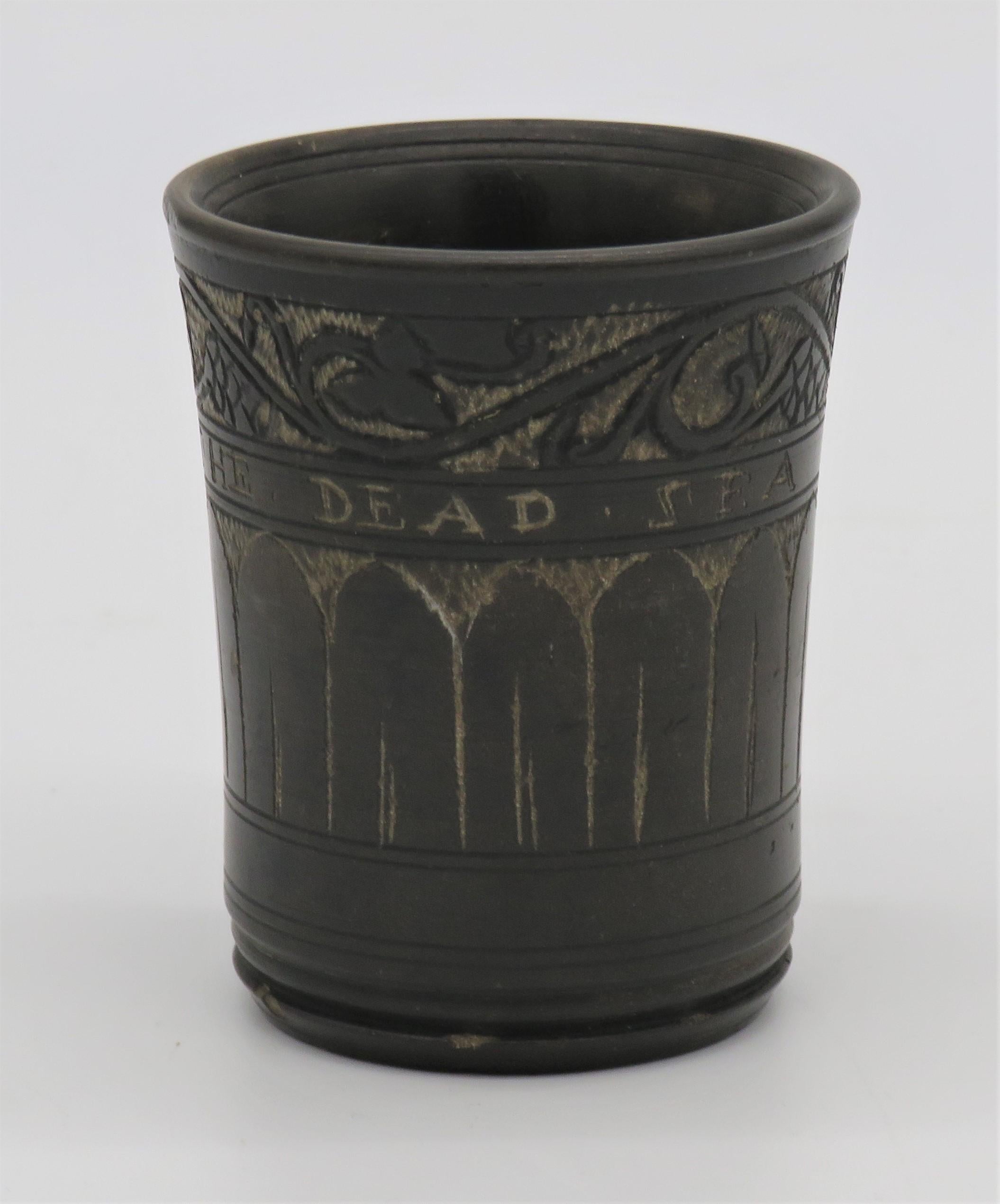 Bitumen dead sea engraved stone cup, circa 1860.
Black bitumen stone carved for Kiddush ceremonies with grape leaves and vines on the top register. 