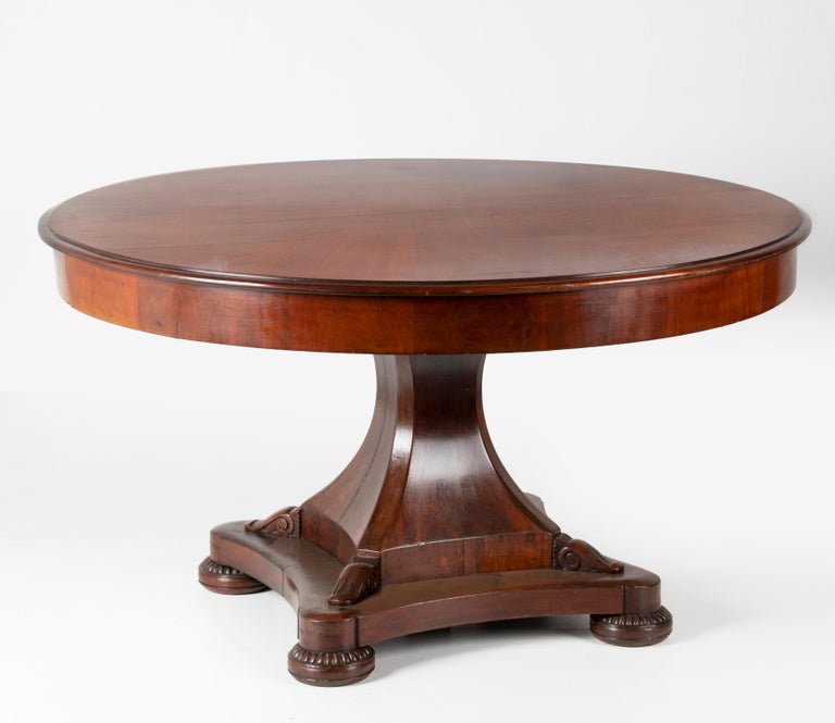 Beautiful antique Dutch table from circa 1850. The table is made of mahogany. Beautiful carvings on the base.