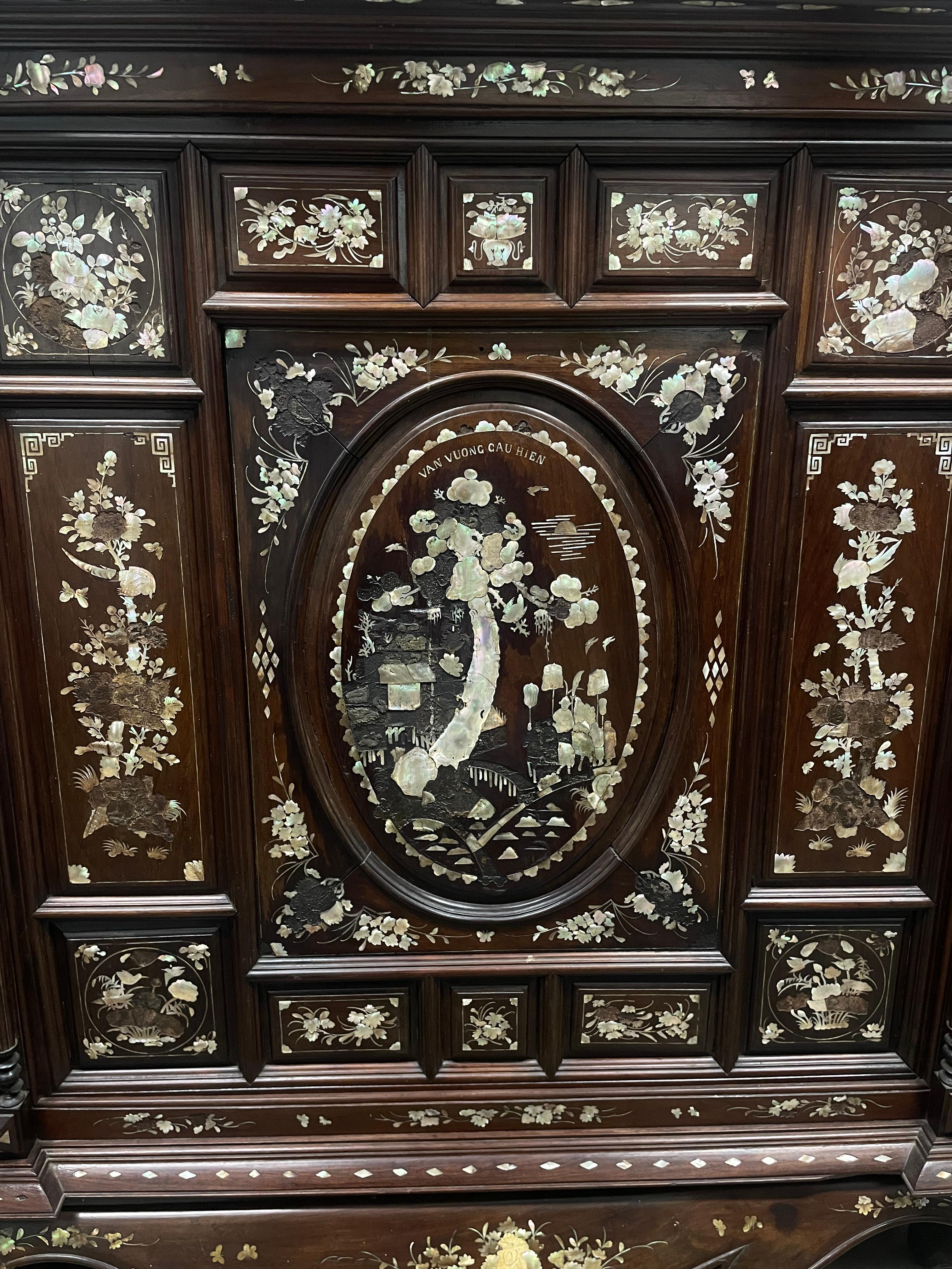 A Dutch Indonesian cabinet from the Mid-19th century. This piece is signed by Van Vuong Hien. It's made of special Rosewood with a Mother of Pearl Abalone inlay. The textures and colors between the wood and the abalone bring a dancing energy to this