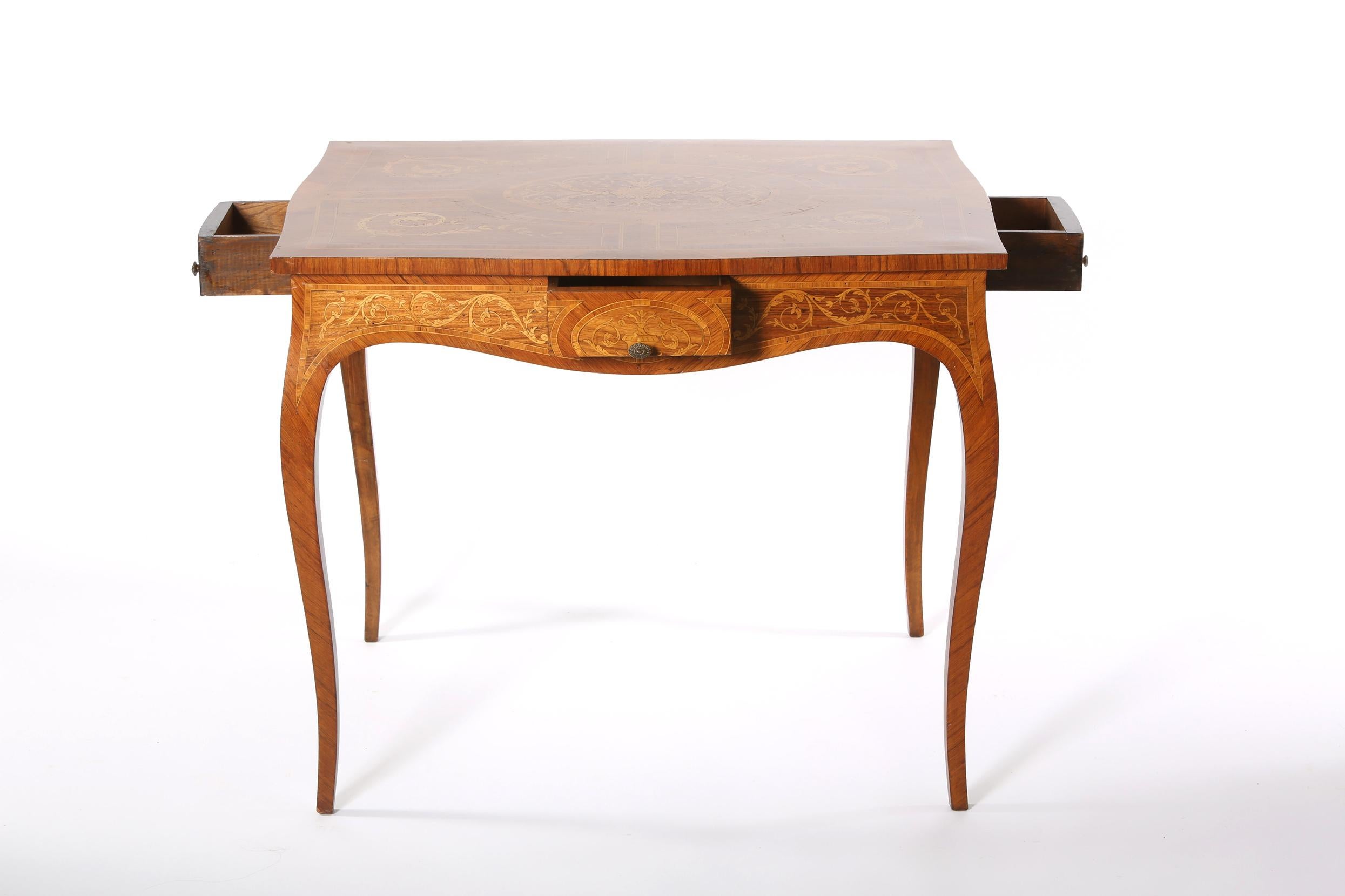 19th century Dutch marquetry center or vanity table with four sides drawer. The table is in good antique condition with wear appropriate to age or use. The table stand about 30 inches high x 36 inches length x 29 inches wide.