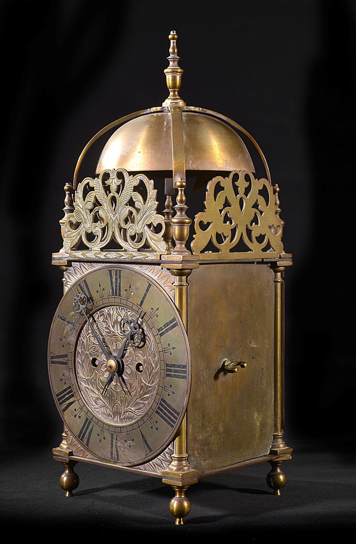 A mid-19th century eight day brass lantern clock with a double fusee movement striking on the hour and half hour.
The brass chapter ring with engraved and black enameled Roman numerals.
The whole with pierced frets and turned corner columns,