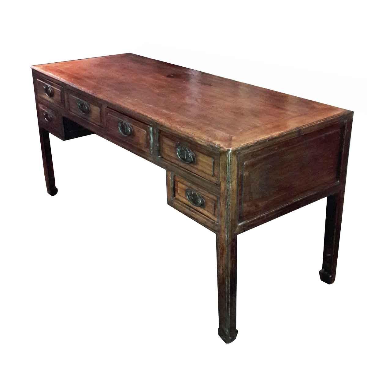 A large elmwood Scholar's desk from Beijing, China, mid-19th century. Six drawers with original brass hardware and key, corner legs and outer gloss finish. This timeless piece is a great example of traditional Chinese furniture craftsmanship, where