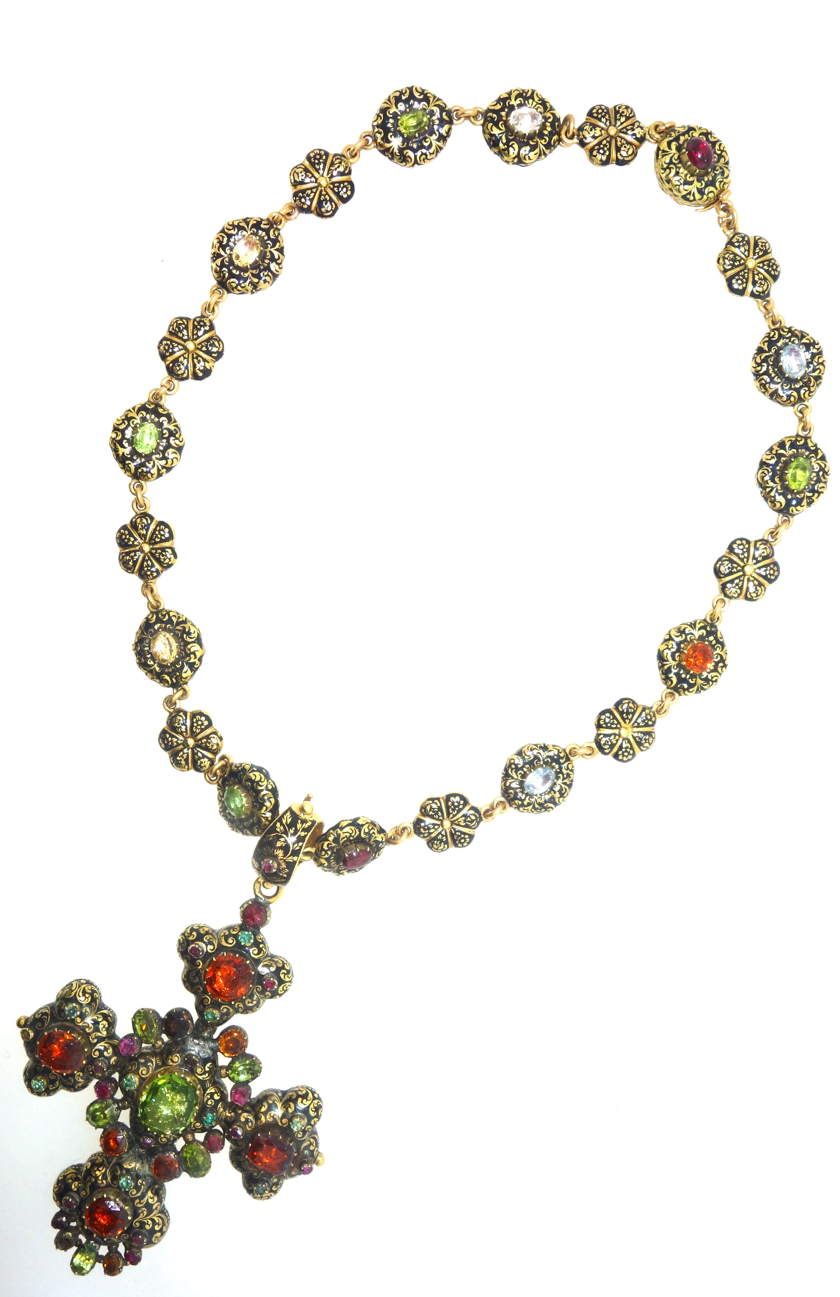 Victorian enamel chain with natural stones, peridot, garnet and aquamarines set (foil-back) throughout.  The enamel, referred to as Swiss enamel, creates an almost three dimensional quality to this pendant and necklace.  The back of the necklace and