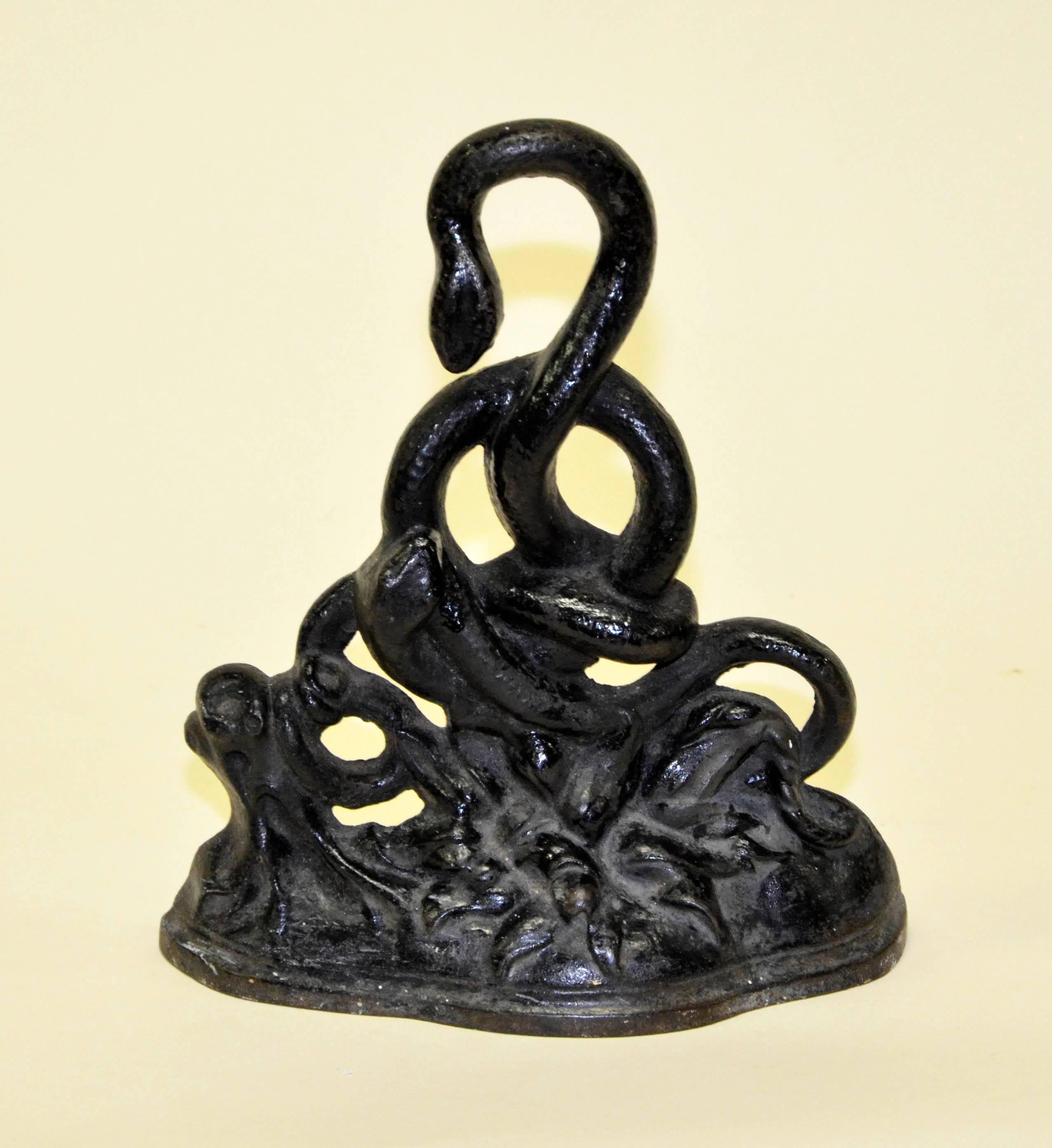 High Victorian Mid-19th Century English Black Cast Iron Door Stop with Intricate Snakes Motif