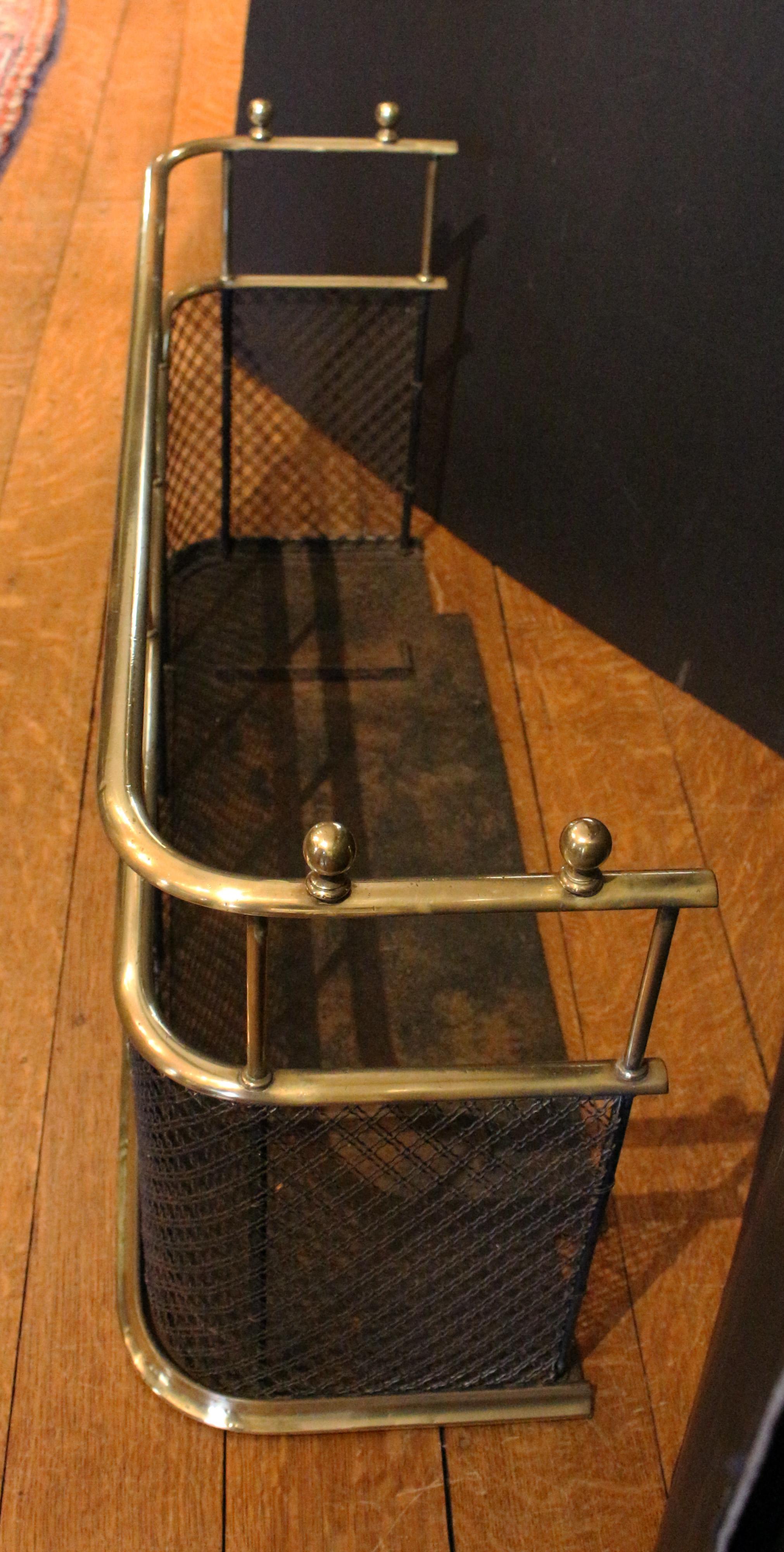 19th Century Mid-19th century English Brass Fire Fender with Double Cross Iron Mesh