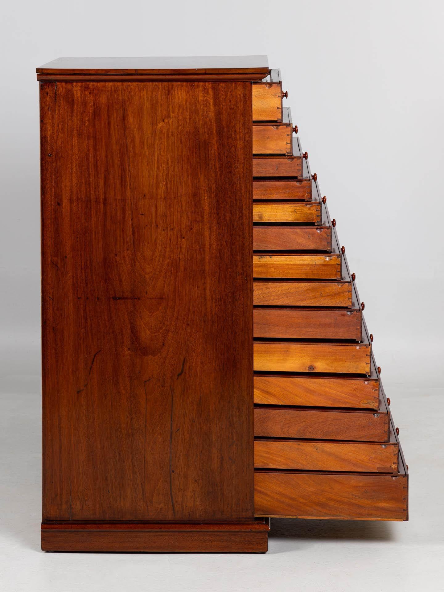 Antique archive or collection cabinet

England
Mahogany
Mid 19th century

Dimensions: H x W x D: 121 x 64 x 57 cm

Description:
Rare antique collection cabinet veneered in Cuba mahogany with a very beautiful grain pattern on the front.

The small
