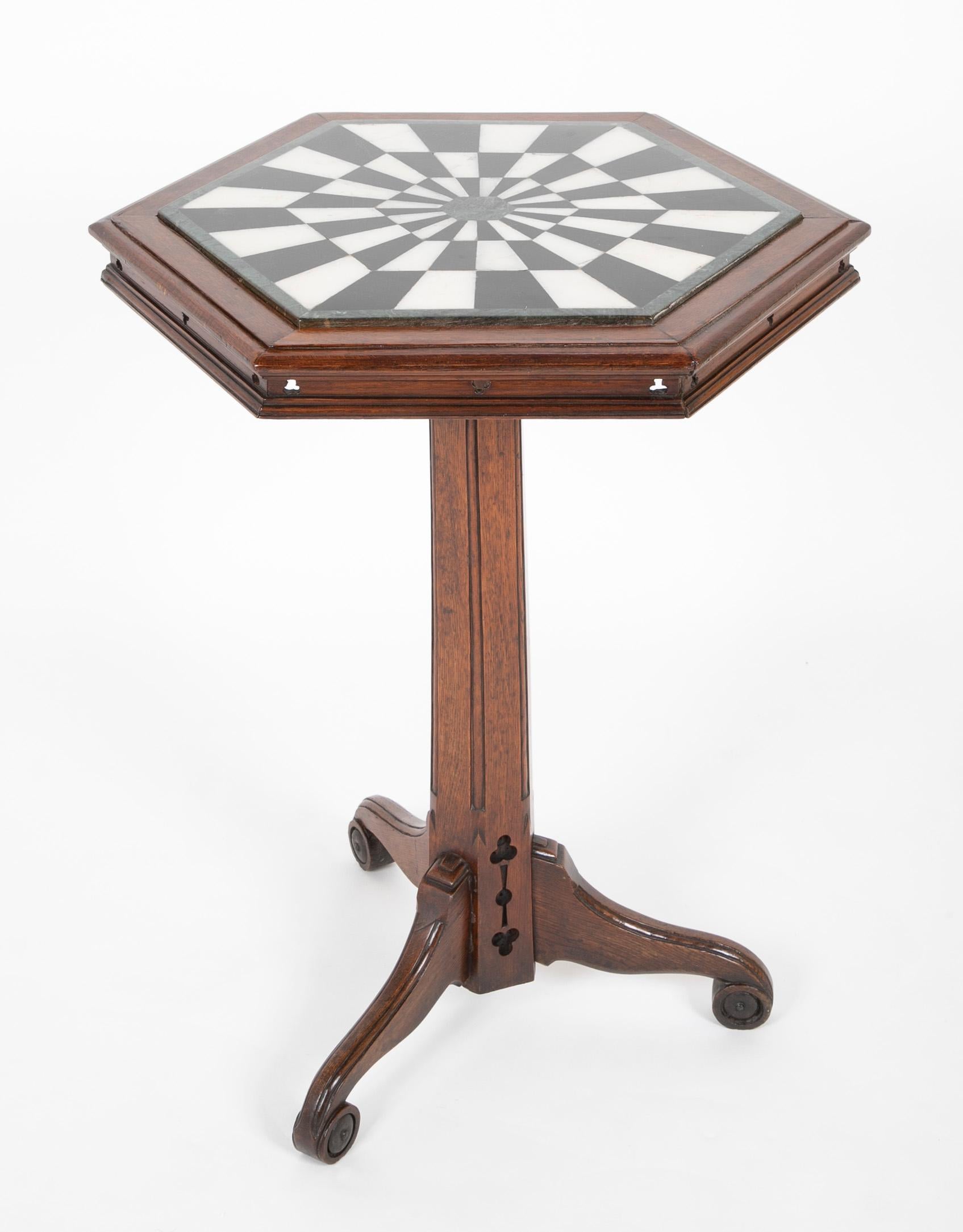 Mid 19th century English oak & marble top occasional table having black and white marble in dart board type design.
