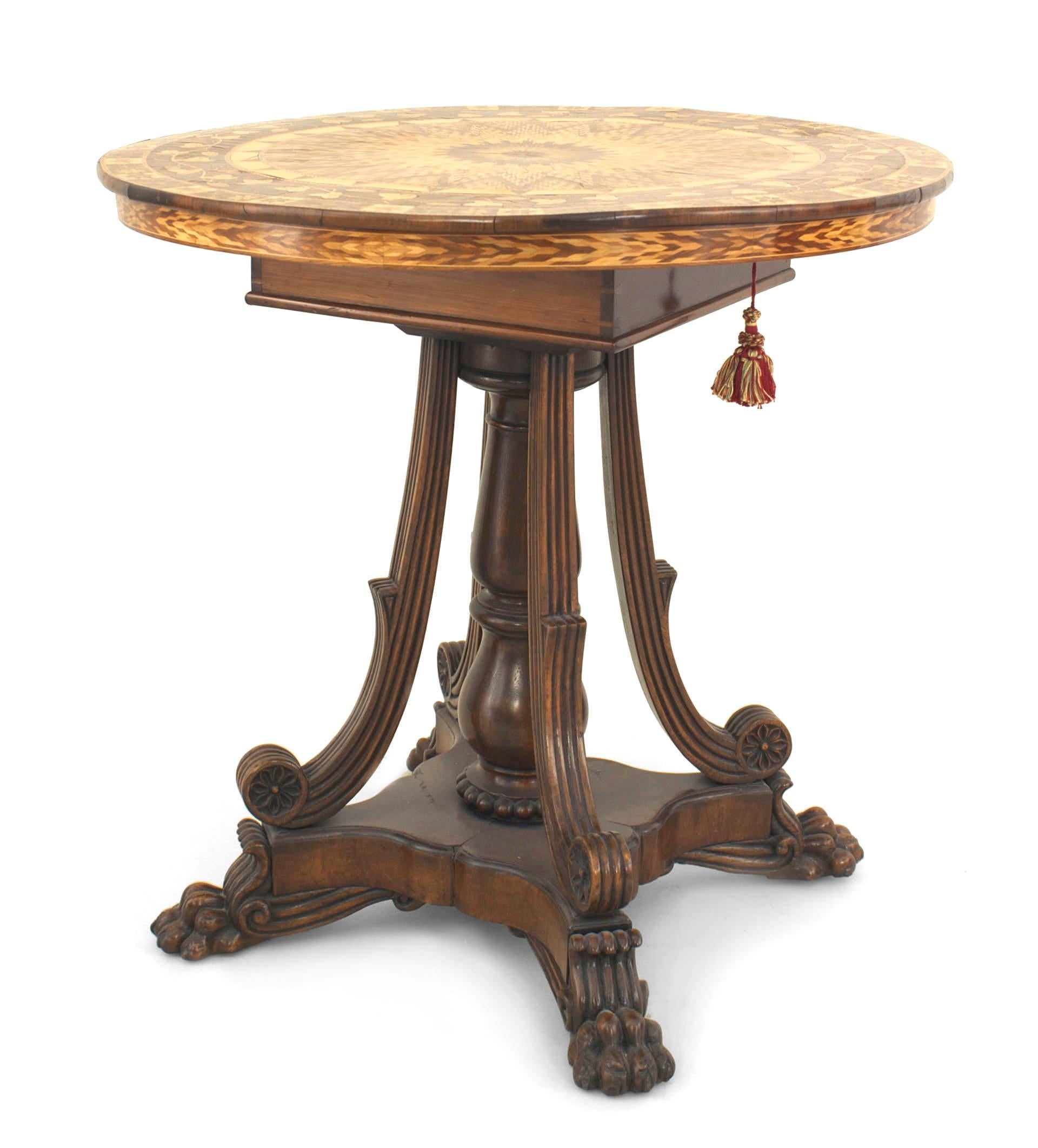 English Regency style (mid-19th century) mahogany end table with a round multi-wood marquetry flip-top revealing a lap desk over the pedestal base with four scroll support legs.