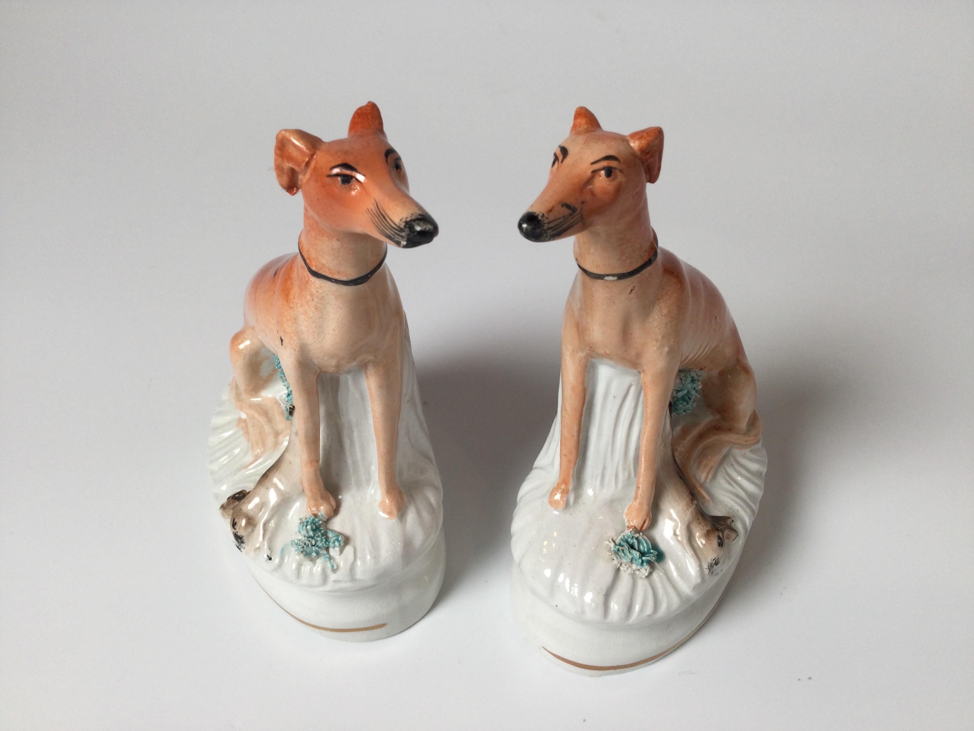 A pair of English Staffordshire seated greyhounds, England Circa 1850's 6.25 inches tall.