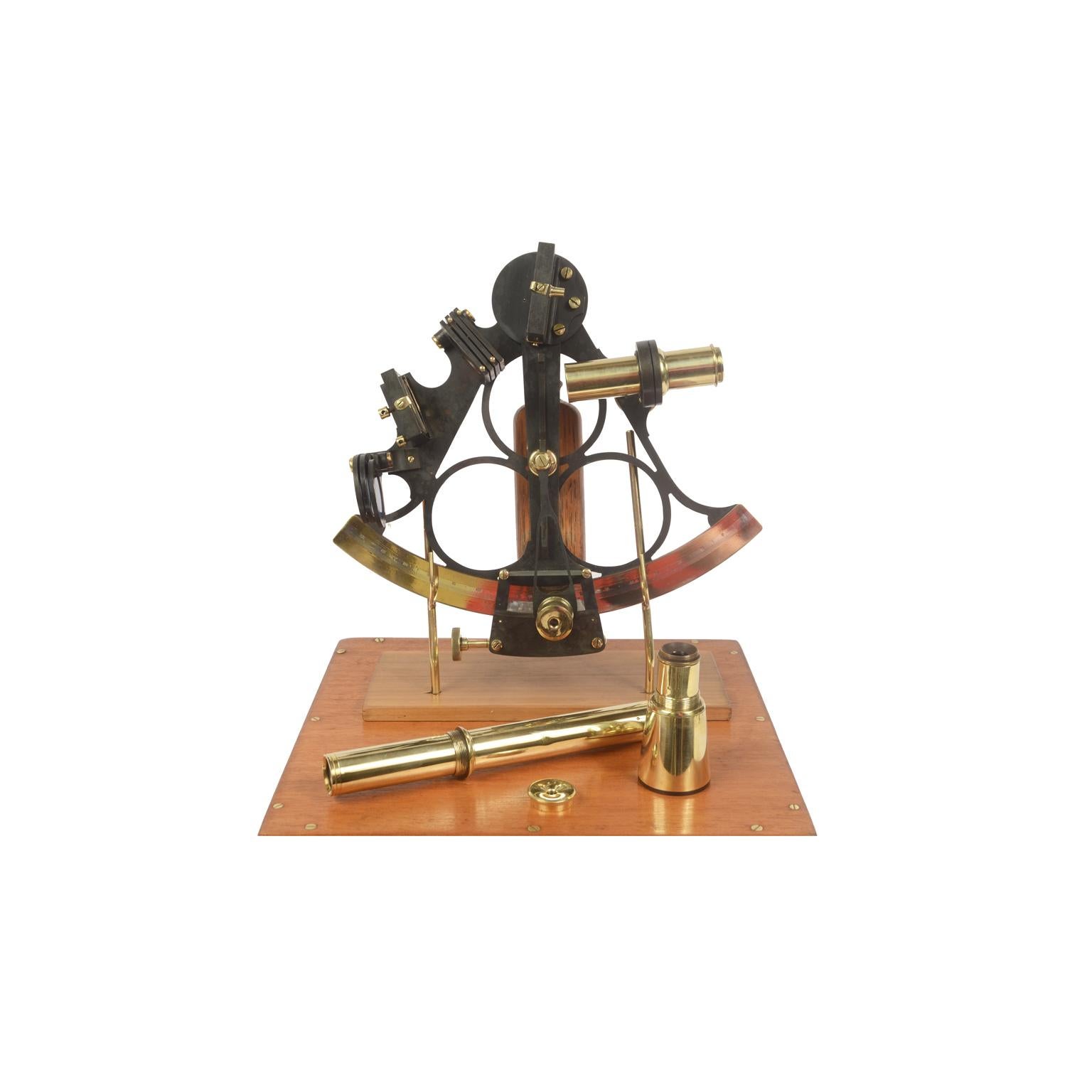 Mid-19th century English sextant of burnished brass, instrument complete with three telescopes, one of which is long, and a filter and it is in its original mahogany box with brass hinges and handle. Brass frame with engraved silver goniometric