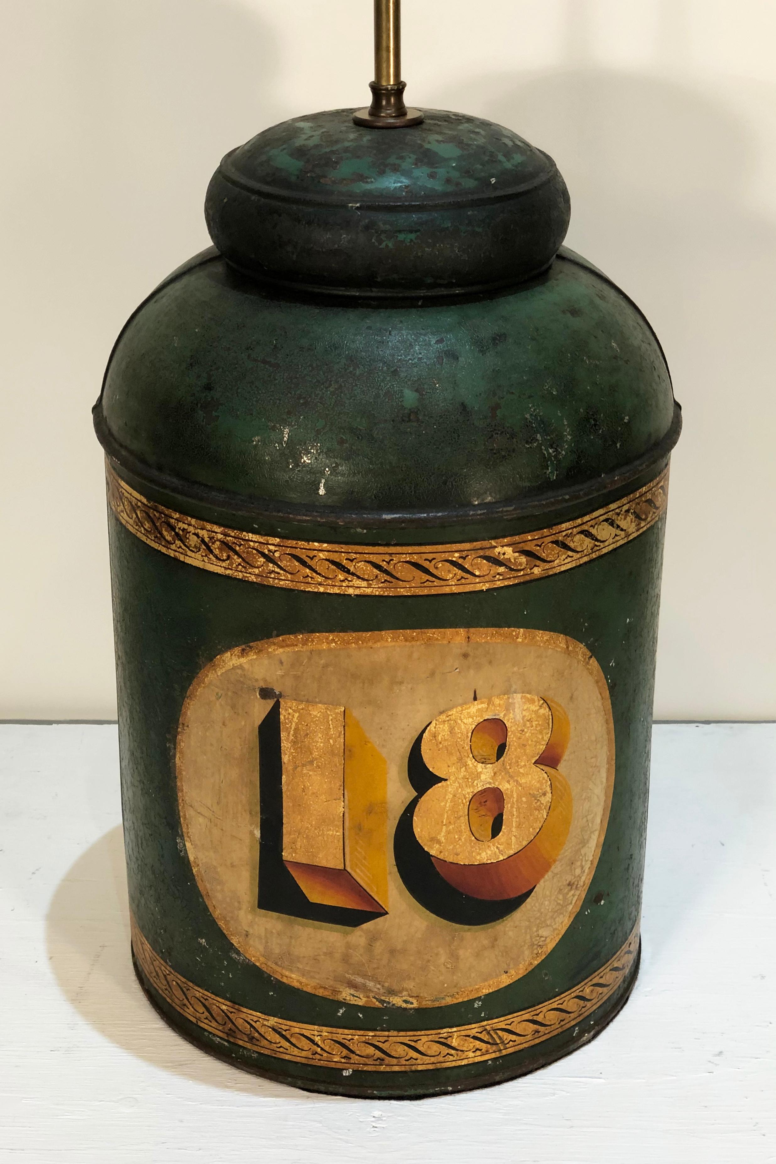 Wonderfully decorated mid-19th century English Tole Spice/Tea Canister, now as a Lamp. This tea/spice canister is #18 in size and retains the original paint and stencilling. Double Edison chain pull sockets with brown raycon cord.
Canister itself