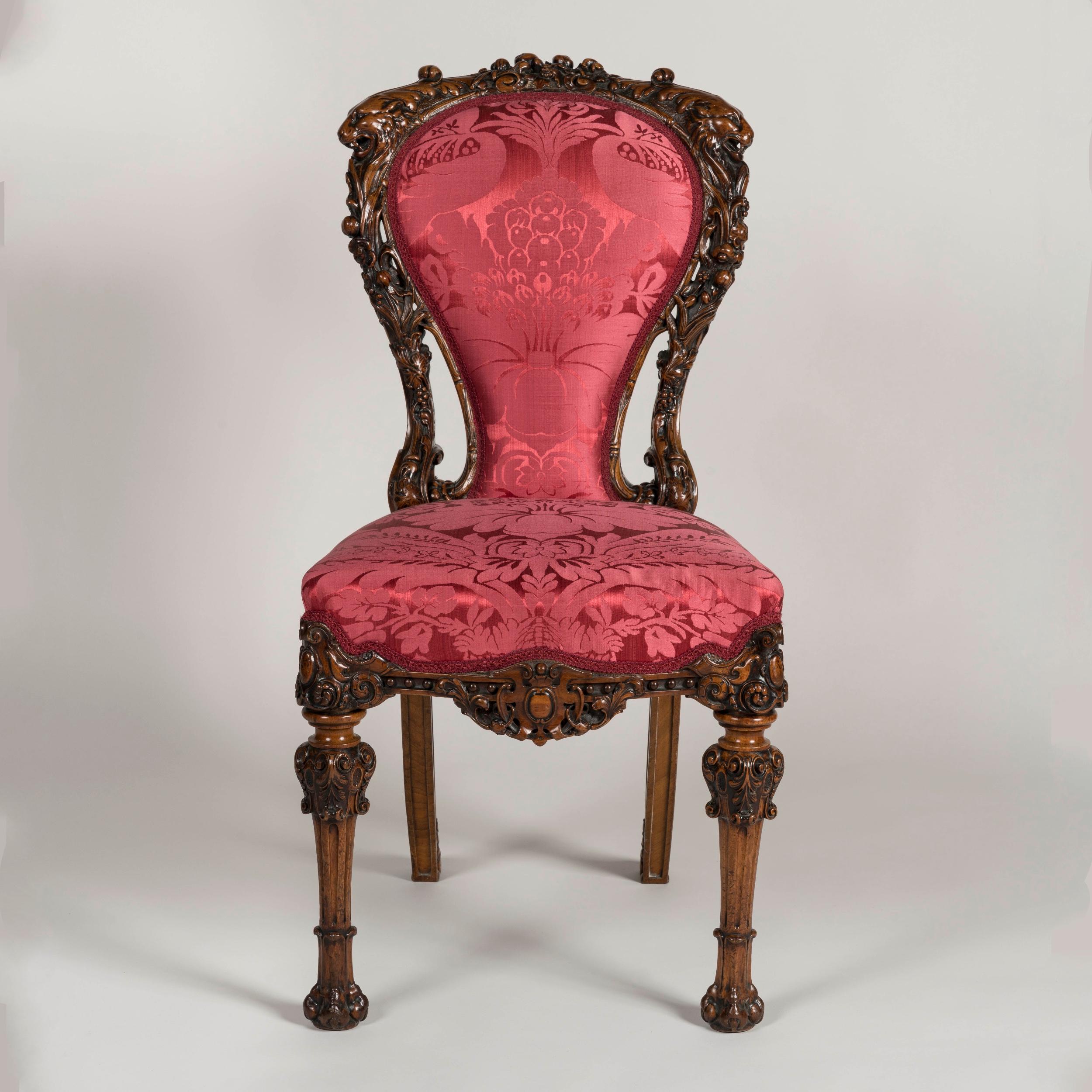 An Exhibition-Quality carved chair
Possibly by Mssrs Hunter of London

An exuberant and striking example of mid-nineteenth century furniture craft, the single chair carved from solid Walnut, with hand-carved details throughout including stylised