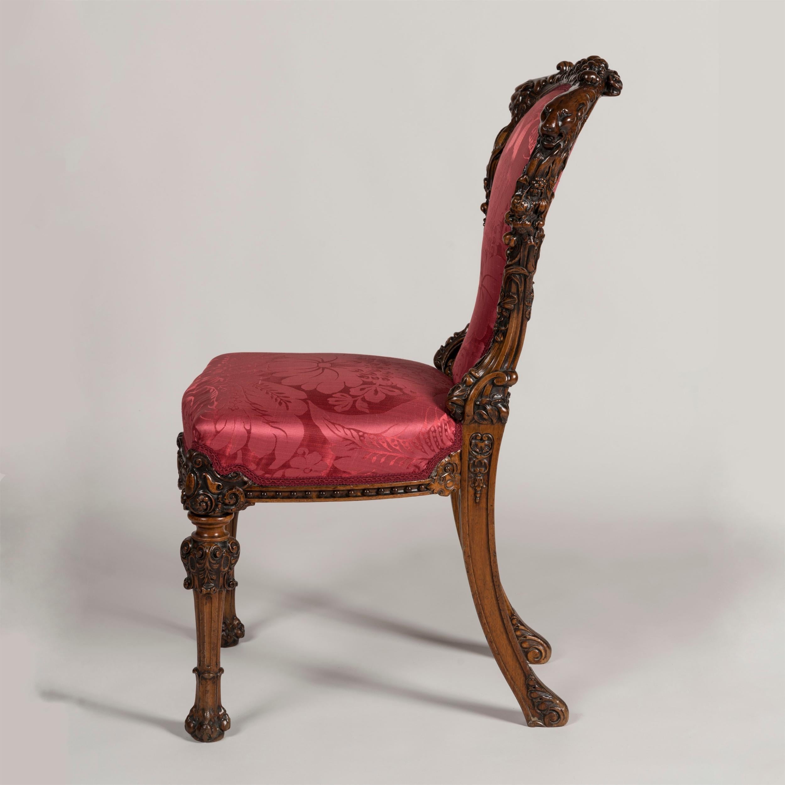 English Mid-19th Century Exuberantly Carved Walnut Chair with Ruby Red Upholstery For Sale
