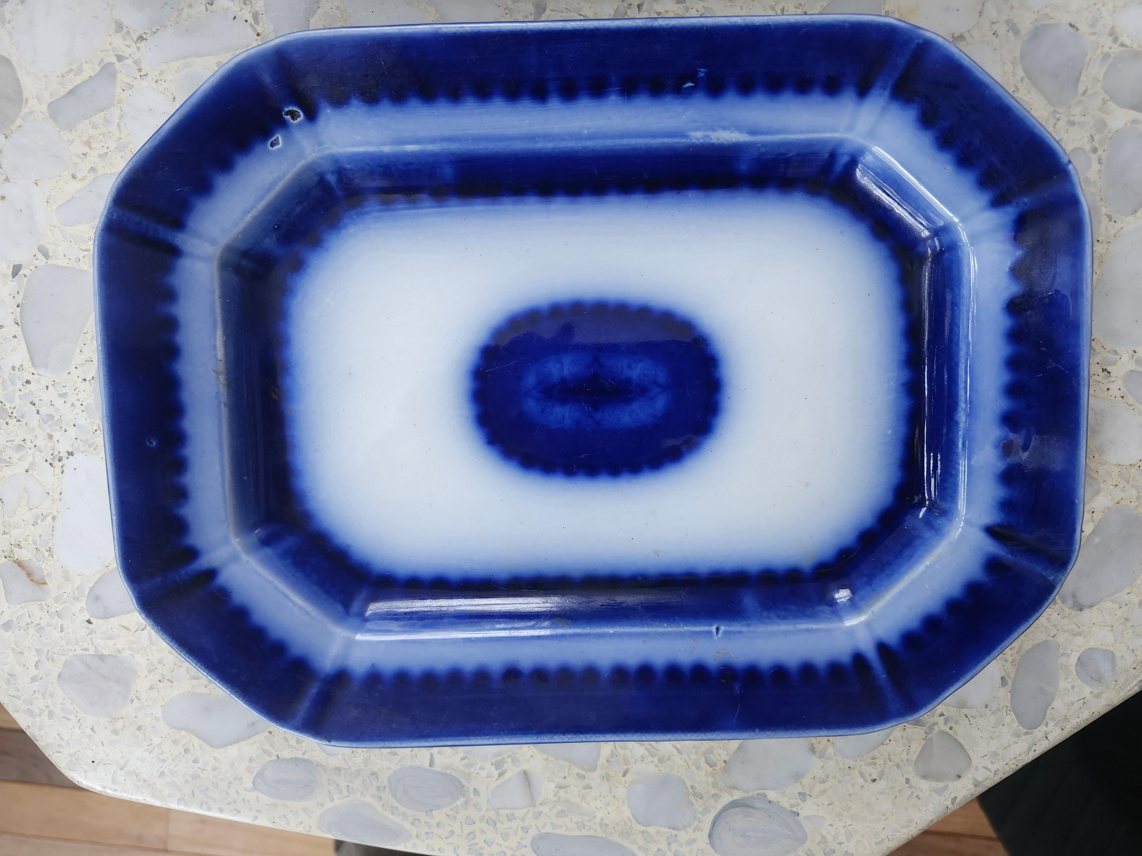 Fantastic pair of nesting platters in the flow blue style Ironstone. Larger platter is 9x 12 x 2, smaller is 8.25 x 11 x 2. Both are free of chips and cracks. Embossed Ironstone on the underside is the only markings, on both. 
Priced and sold as a