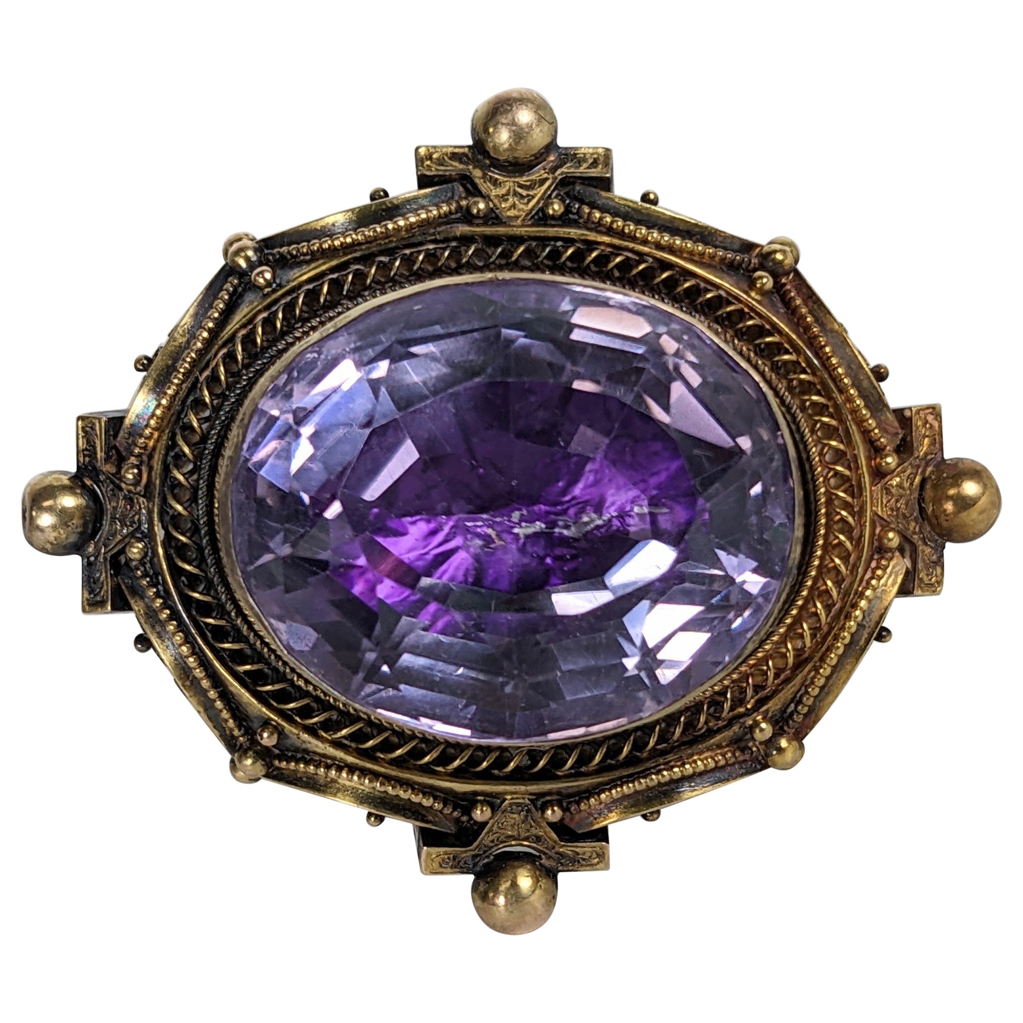 Mid 19th Century Foiled Amythest Etruscan Brooch For Sale