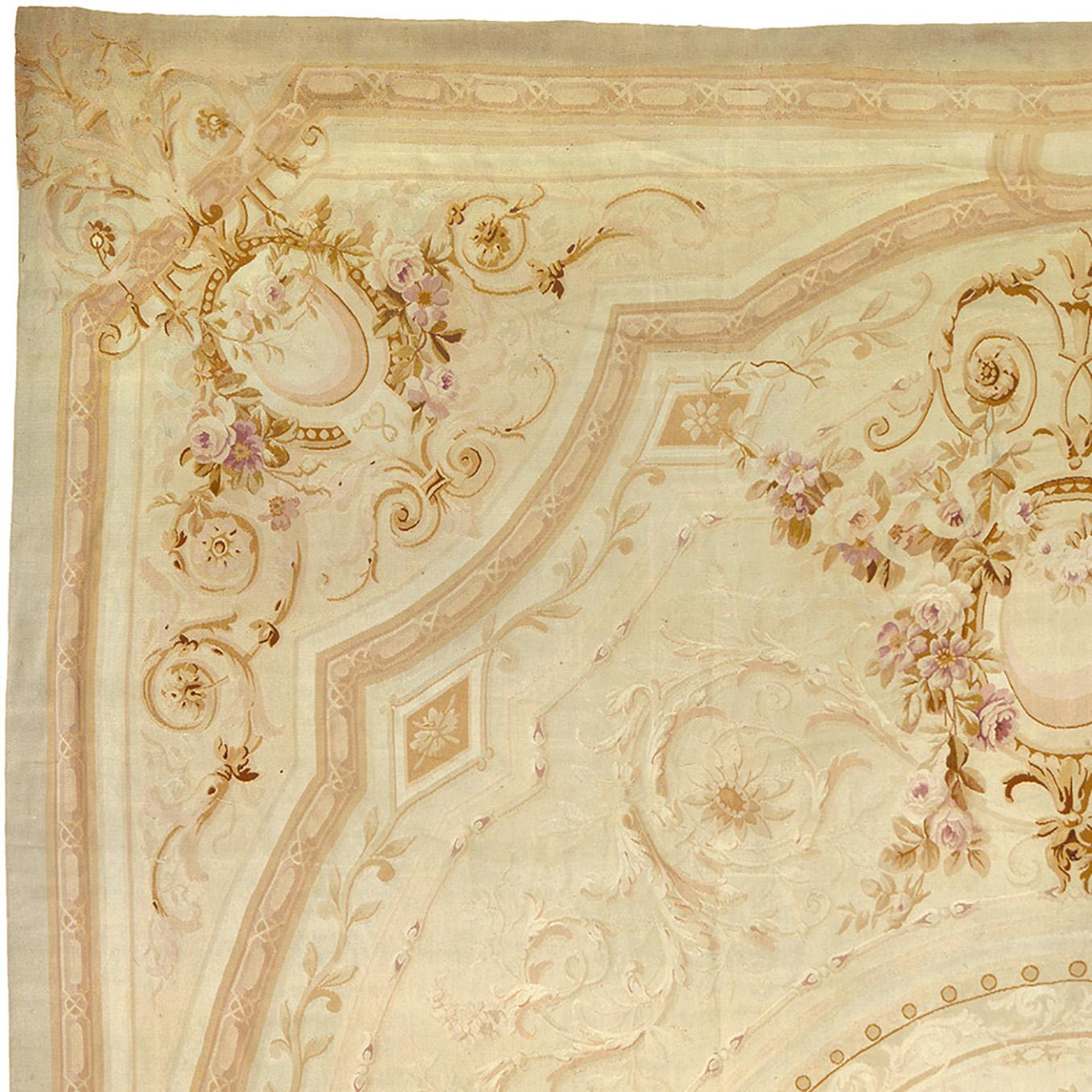 Antique Aubusson rug
France, 1870
Beige and pink floral design
Dimensional border

21'4