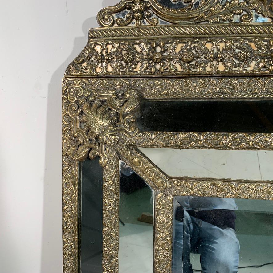 Beveled Mid-19th Century French Brass Repoussee Cushion Frame Mirror