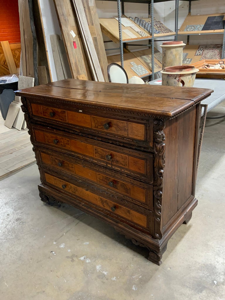 This beautifully detailed item is made of oak with inlay mahogany. Item dates back to the 1850s and contains many drawers inside of fall-front.