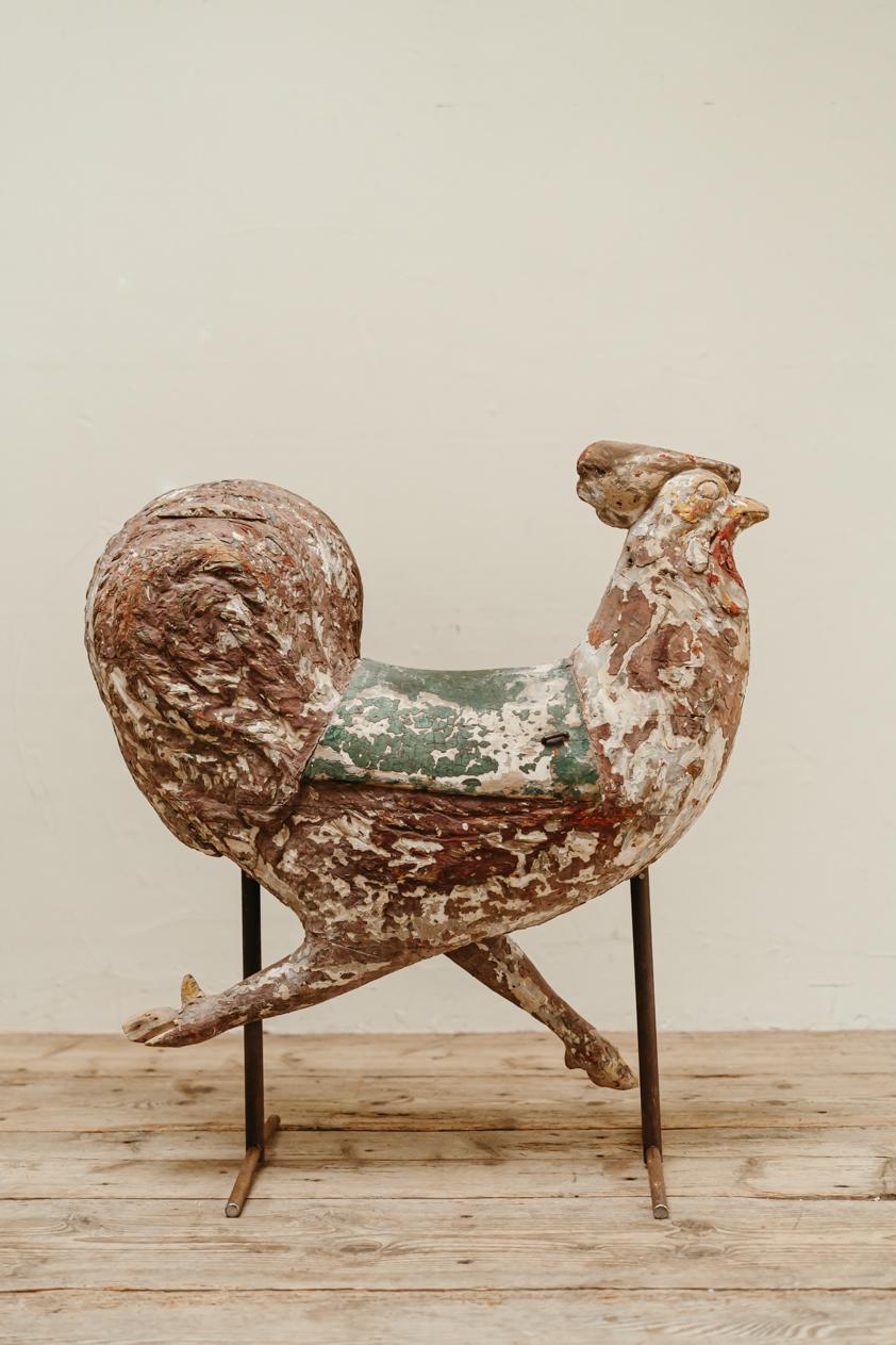 in love with this fairground limewood rooster, made in the mid 19th century in France, a rare find, a true collectors item, wonderful patination, original paint, mounted on iron base.