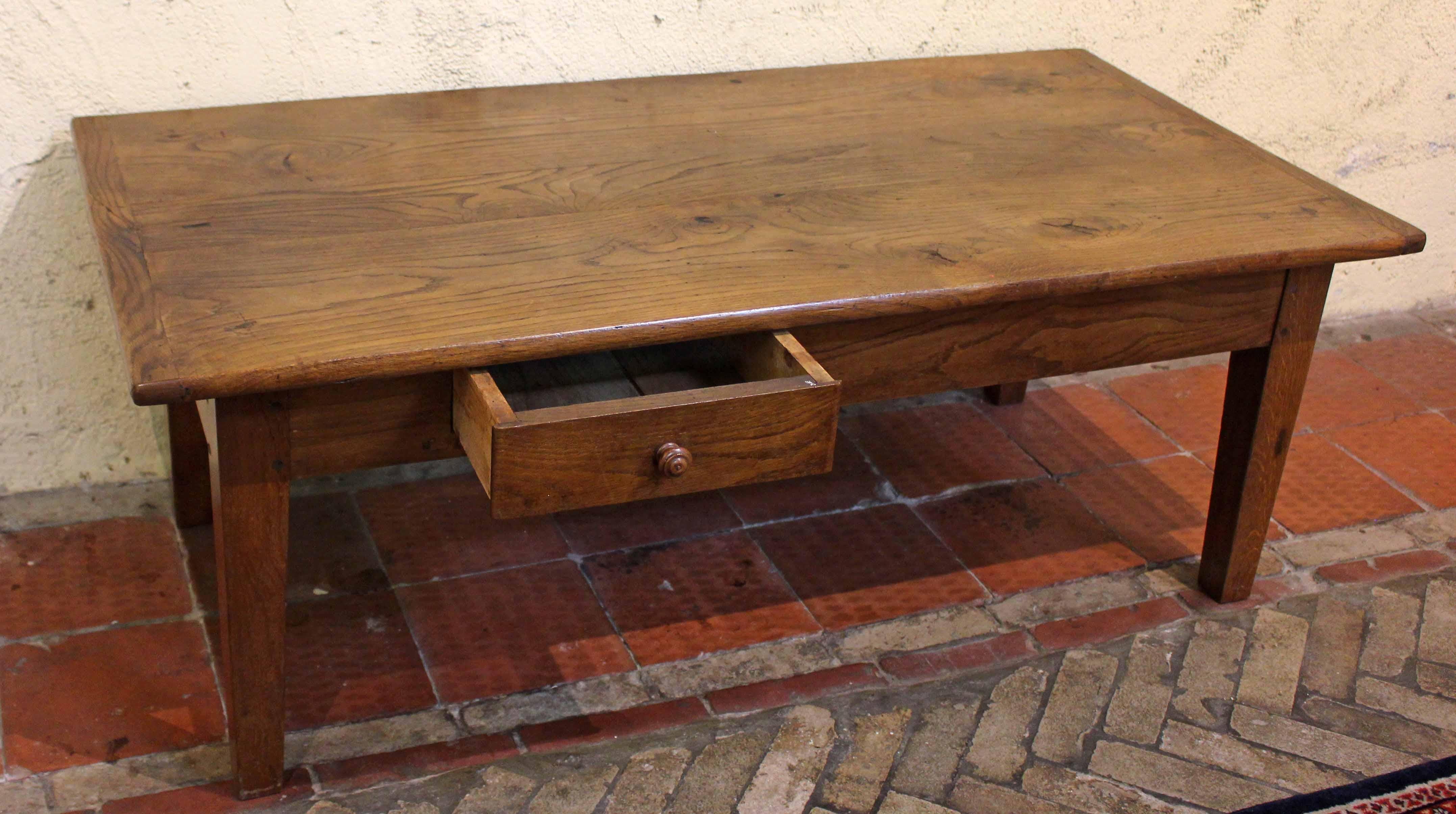 A mid-19th century country French coffee table, reduced from full table height. Well figured chestnut & oak. One side & one end drawer each with turned wood knob. Bread board ends. Chunky tapered legs.

Whitehall Antiques is a family business that