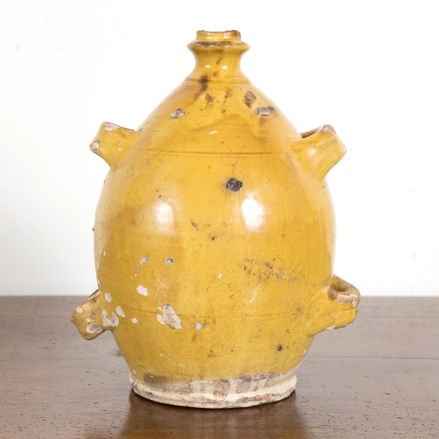 Glazed Mid-19th Century French Conscience Water or Olive Oil Jug with Yellow Glaze