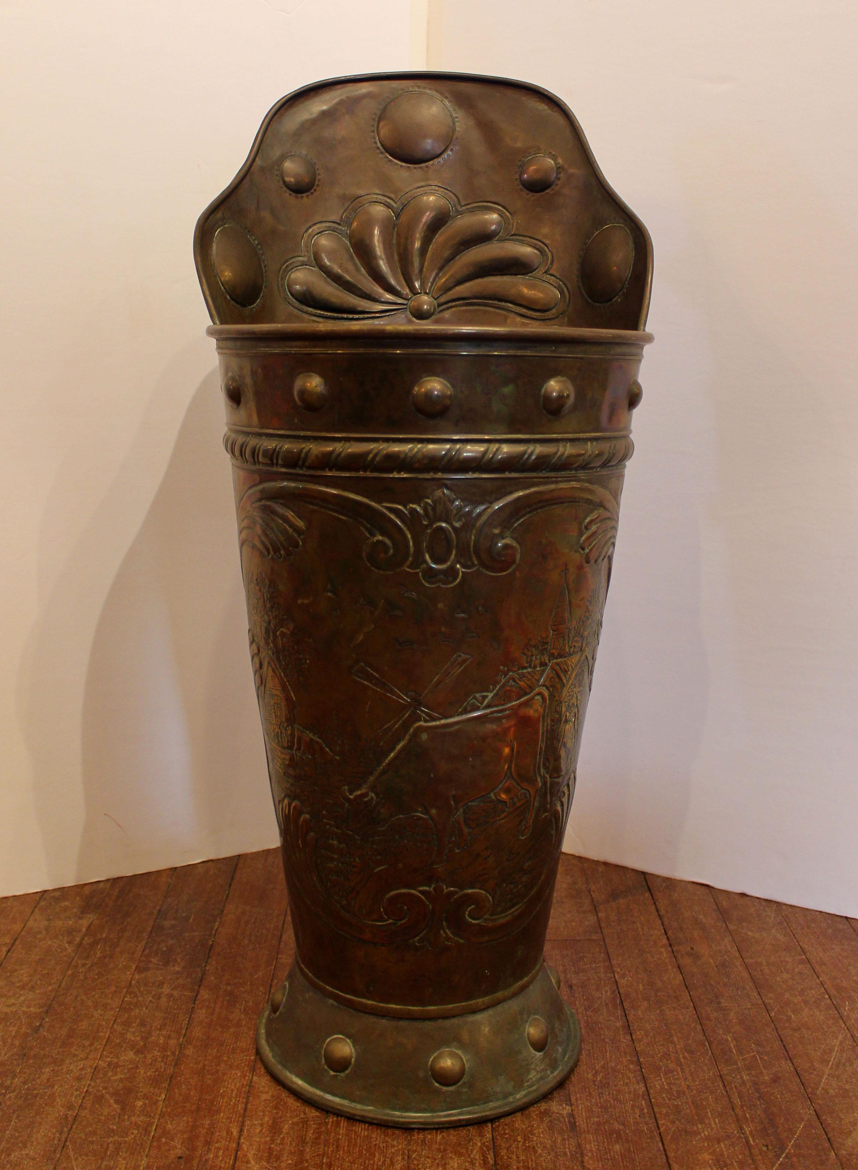 Mid-19th century copper grape hod, French. Decorated with large bosses, gadrooned fan c-scrolls, and rural village scene with a cow & windmill in the background. Ideal as a stick & umbrella stand, for kindling by the fire, etc. The back with crusty