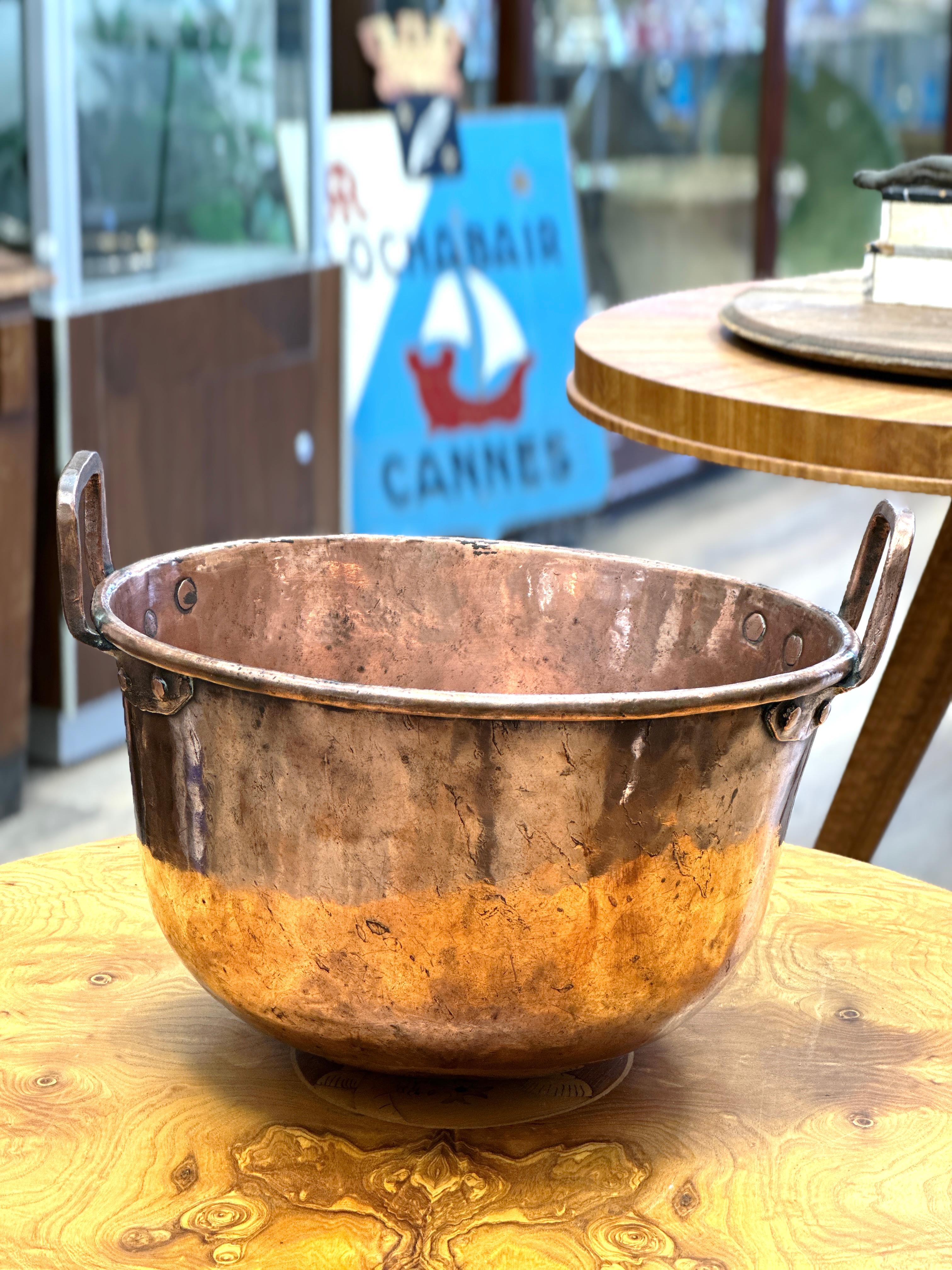 Here is a lovely Mid-19th Century French Copper Jelly and Jam Boiling Bowl 

Bring an authentic French countryside touch to your kitchen with this large antique copper marmalade bowl. Made in France, circa mid 19th century, this decorative “Bassine