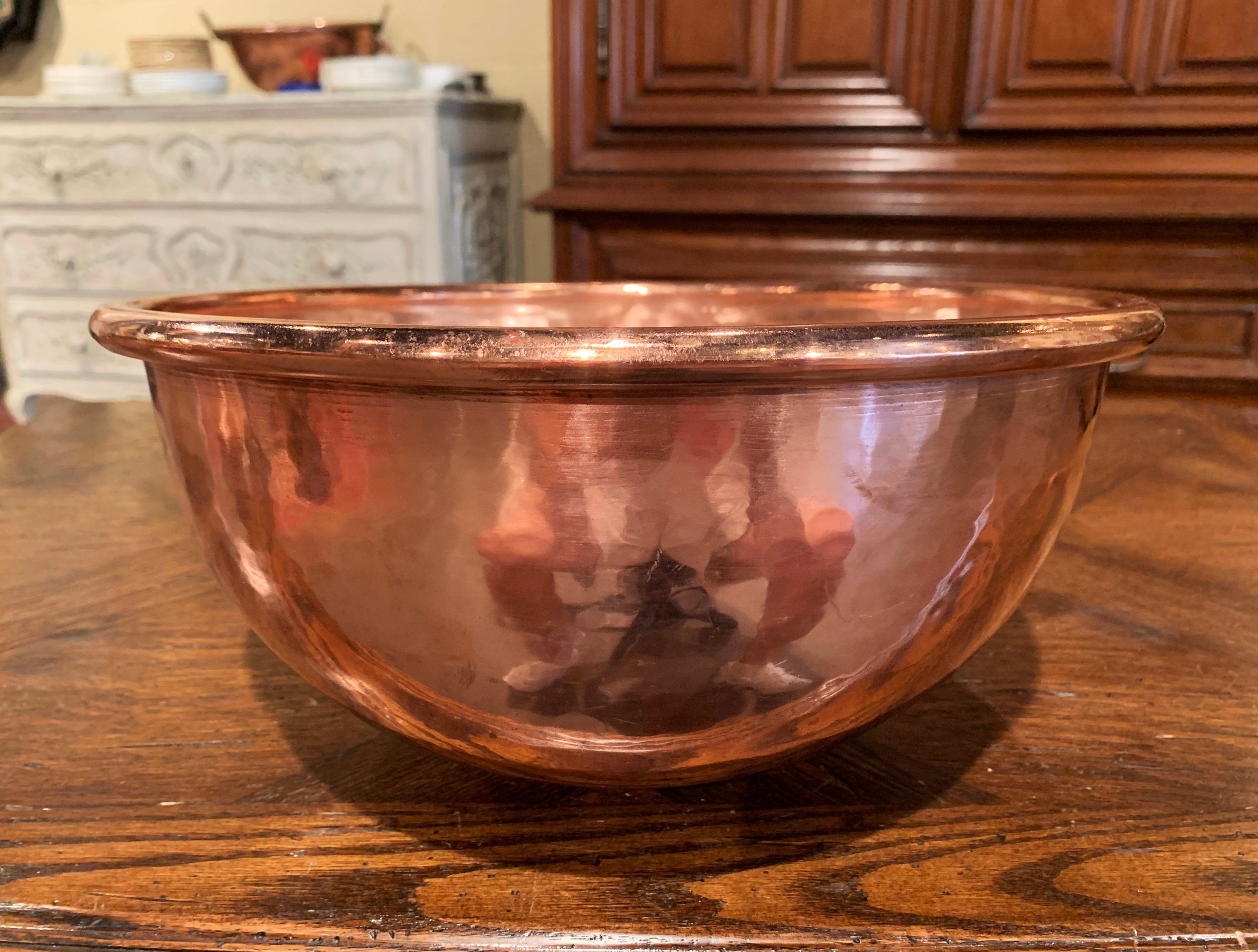 Keep your wine chilled in style with this elegant round bowl, crafted in Northern France circa 1870 and originally used for home made jelly, the circular copper bowl with rounded rim is decorated with a small round side handle attached with rivets.